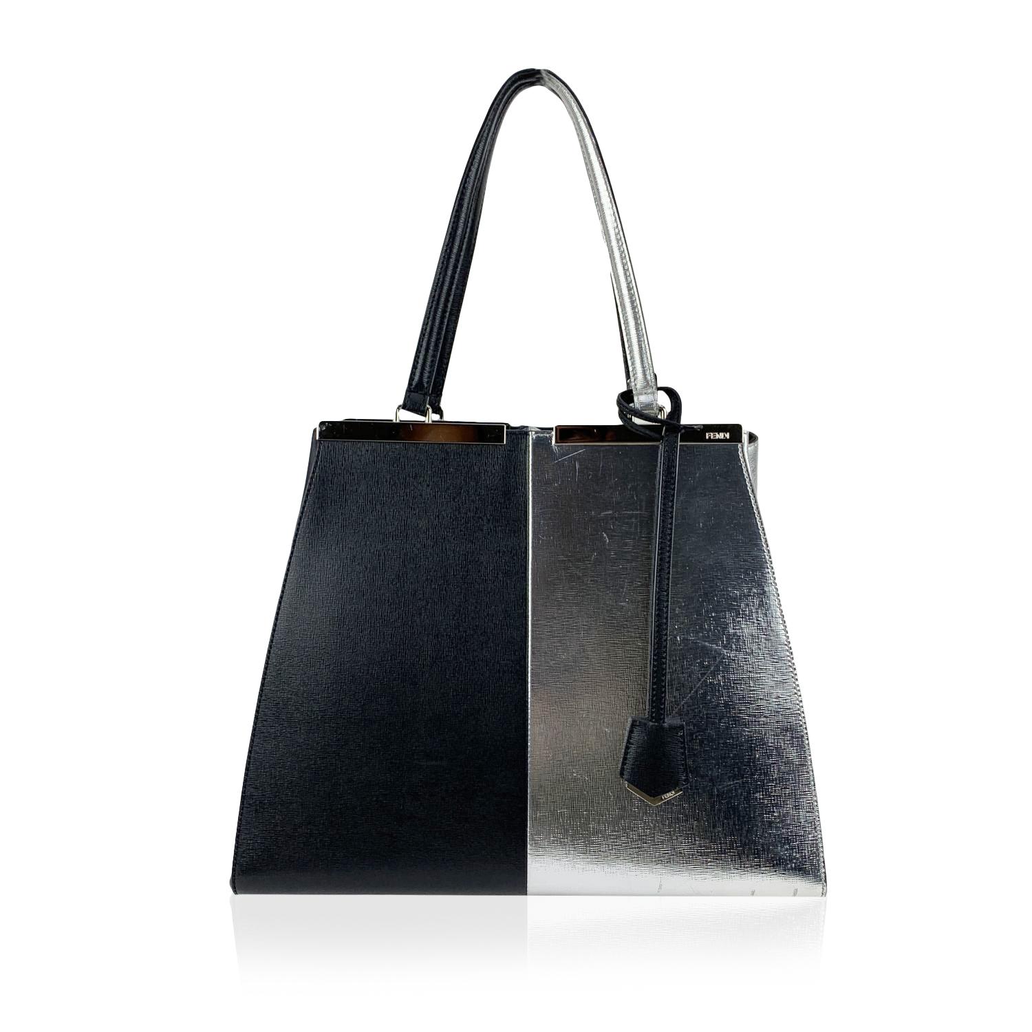 This beautiful Bag will come with a Certificate of Authenticity provided by Entrupy. The certificate will be provided at no further cost.

Fendi bicolor leather '3Jours' tote bag. Black and silver leather. Structured design and trapeze silhouette.