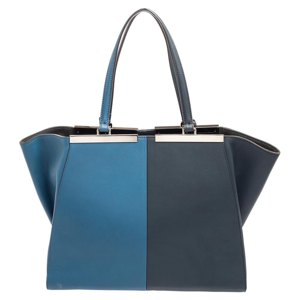 Fendi's 3Jours tote is one of the most iconic designs from the label and continues to gain popularity globally. This version is made from bi-colored leather, which is embellished with silver-toned hardware. It has dual handles and a spacious