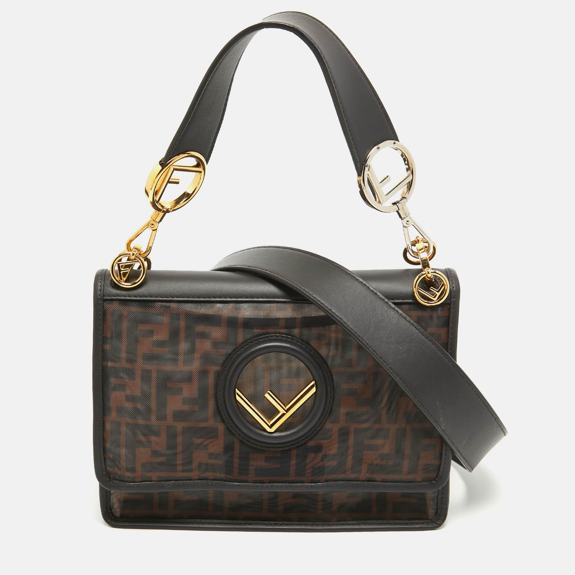 This Kan I shoulder bag from Fendi deserves a place in your luxury handbag collection. Accented with the slanted Fendi logo in two-toned hardware on the exterior creates a subtle contrast. With a flap-type closure and a spacious interior, this bag