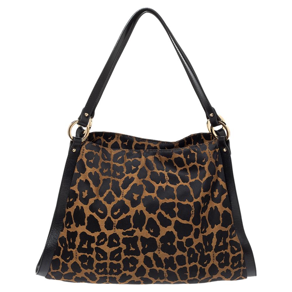 Win praises every time you swing this classic Chef bag. The inner fabric is well-fitted and the leopard print canvas, leather exterior accented with a logo charm truly speaks Fendi. It is a timeless investment. Carry this instantly-recognisable