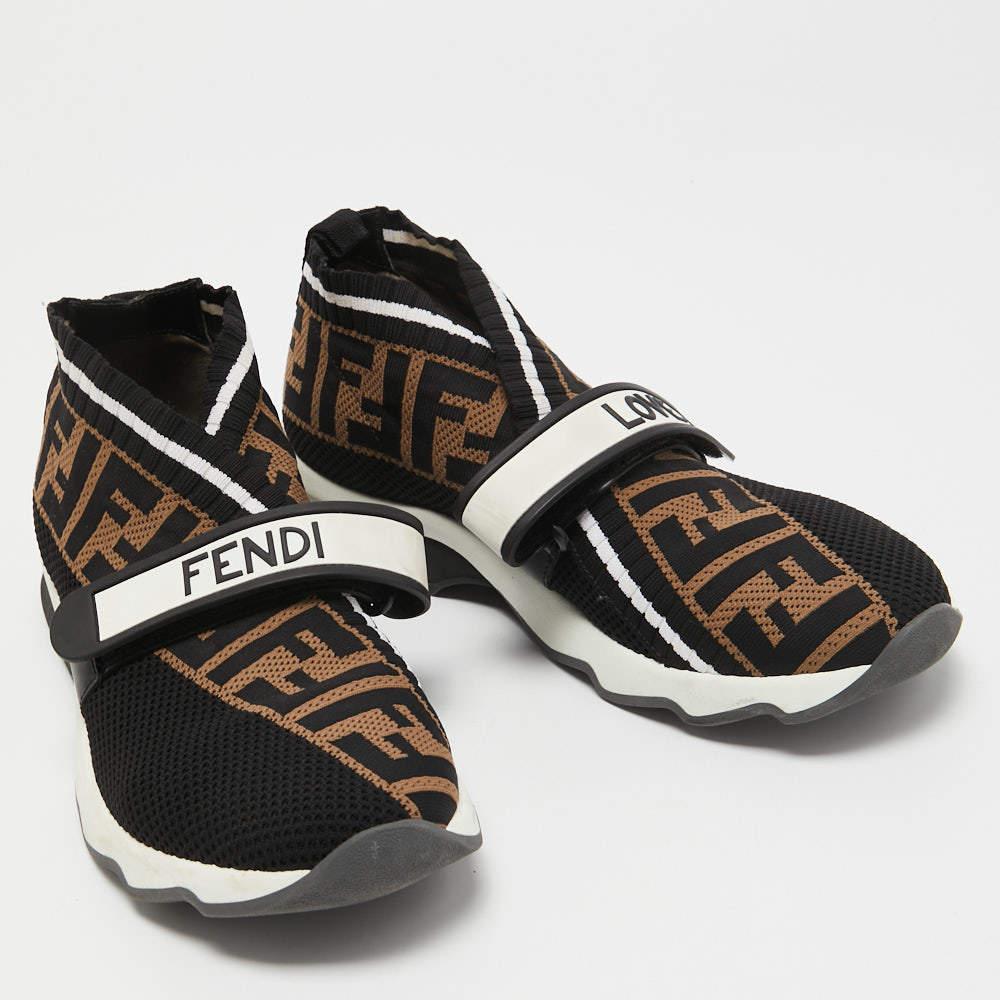 Enjoy footwear ease with this pair of Rockoko sneakers by Fendi. They've been crafted from knit fabric and designed with the Zucca logo and FENDI-LOVE velcro straps. Equipped with comfortable fabric-lined insoles and tough rubber soles, they are