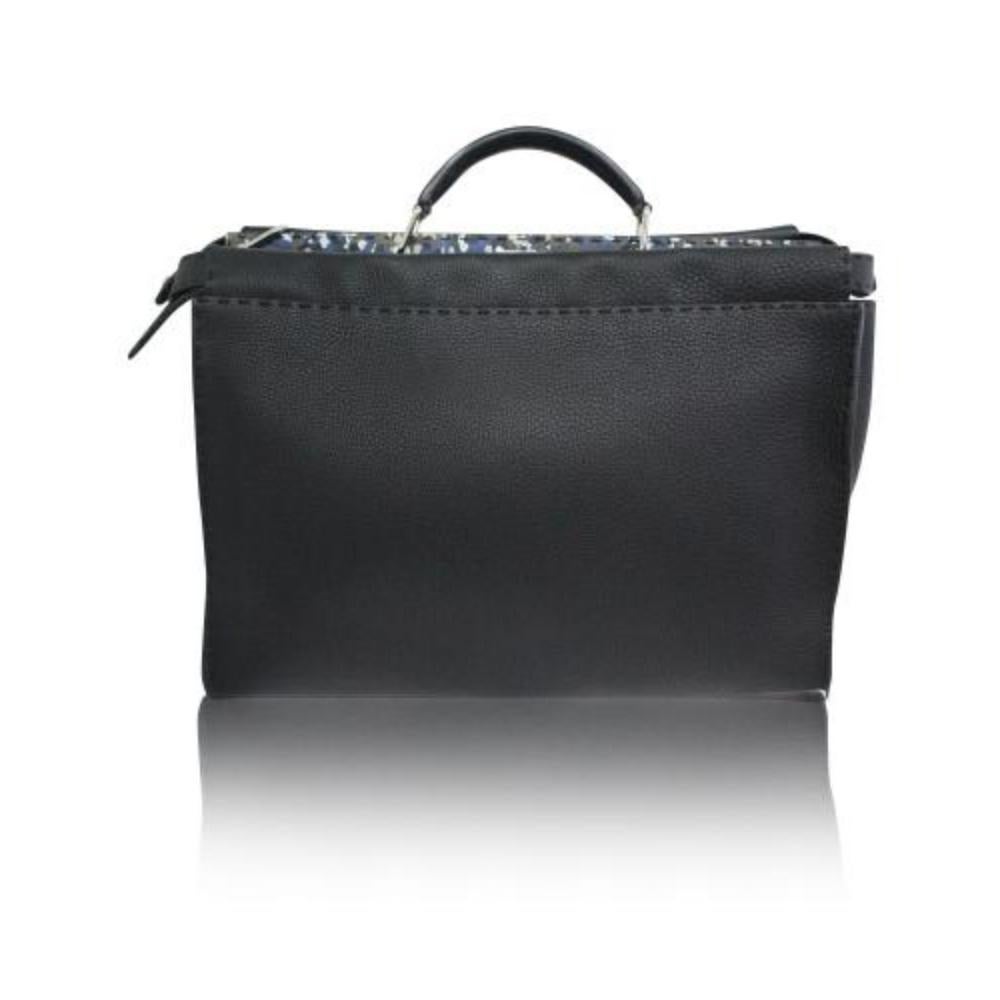 Fendi Black Calfskin Iconic Peekaboo Fit Bag

Handmade in Italy, the Fendi Peekaboo Iconic Fit Bag is another favorite office accessory. It comes in classic black color, made in sturdy calfskin leather, with raw edging and hand-sewn stitching. The