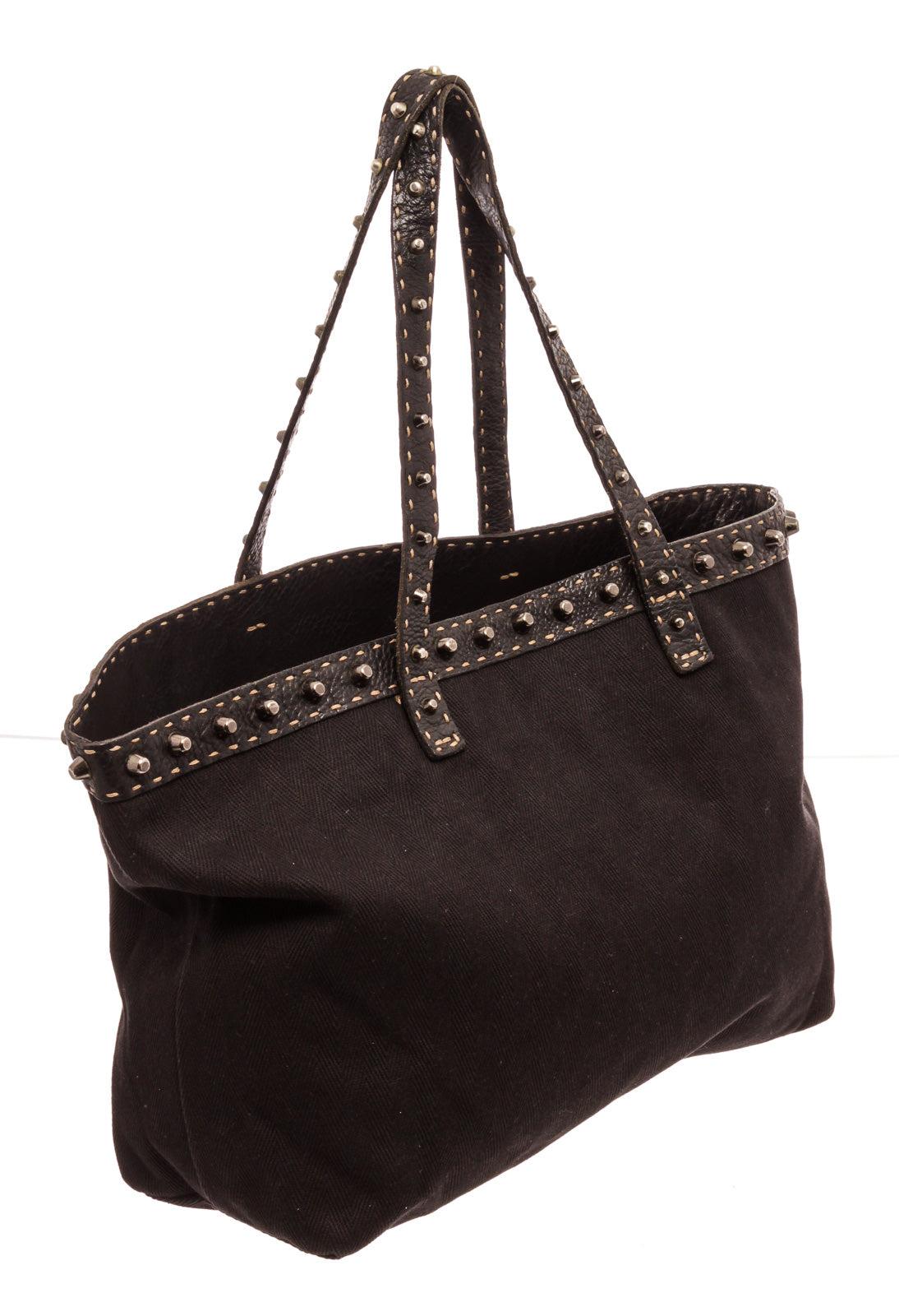 Fendi Black Canvas Selleria Tote Bag with gold-tone hardware, trim leather, interior zip pockets, shoulder strap and flap closure.
33085MSC