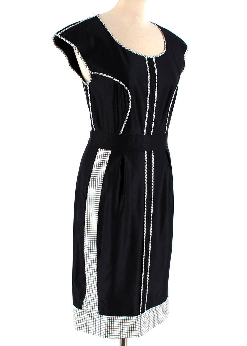 Fendi Black Diamond Piped Cap Sleeve Dress

Scoop Neck
Black and White Check piping on chest, trim and center of bodice
Check print on sides of skirt as well as the bottom cuff
Black waistband
Made in Italy
Dry-clean Only 

Measurements are taken