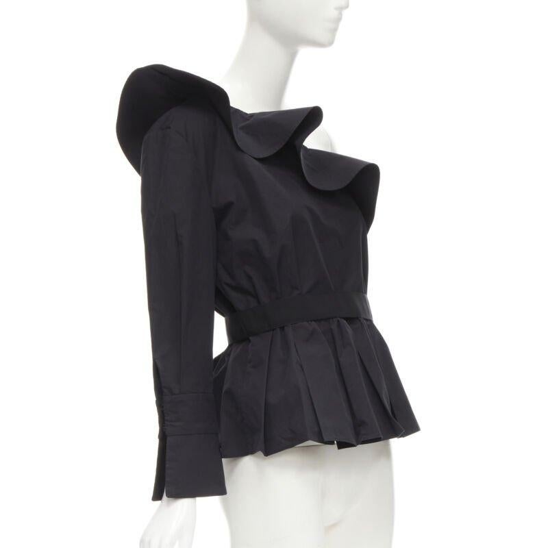 FENDI black cotton ruffle one shoulder belted peplum top IT42 M
Reference: KNLM/A00001
Brand: Fendi
Material: Cotton
Color: Black
Pattern: Solid
Closure: Zip
Lining:  Unlined
Extra Details: Detachable snap button grosgrain belt.
Made in: