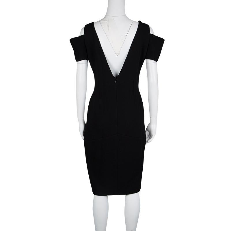 A beautiful evening dress with an alluring and chic look, this Fendi dress is sure to take a special place in your collection. Constructed in black wool blended fabric, this dress features a cascading ruffle detail along the front with a button at