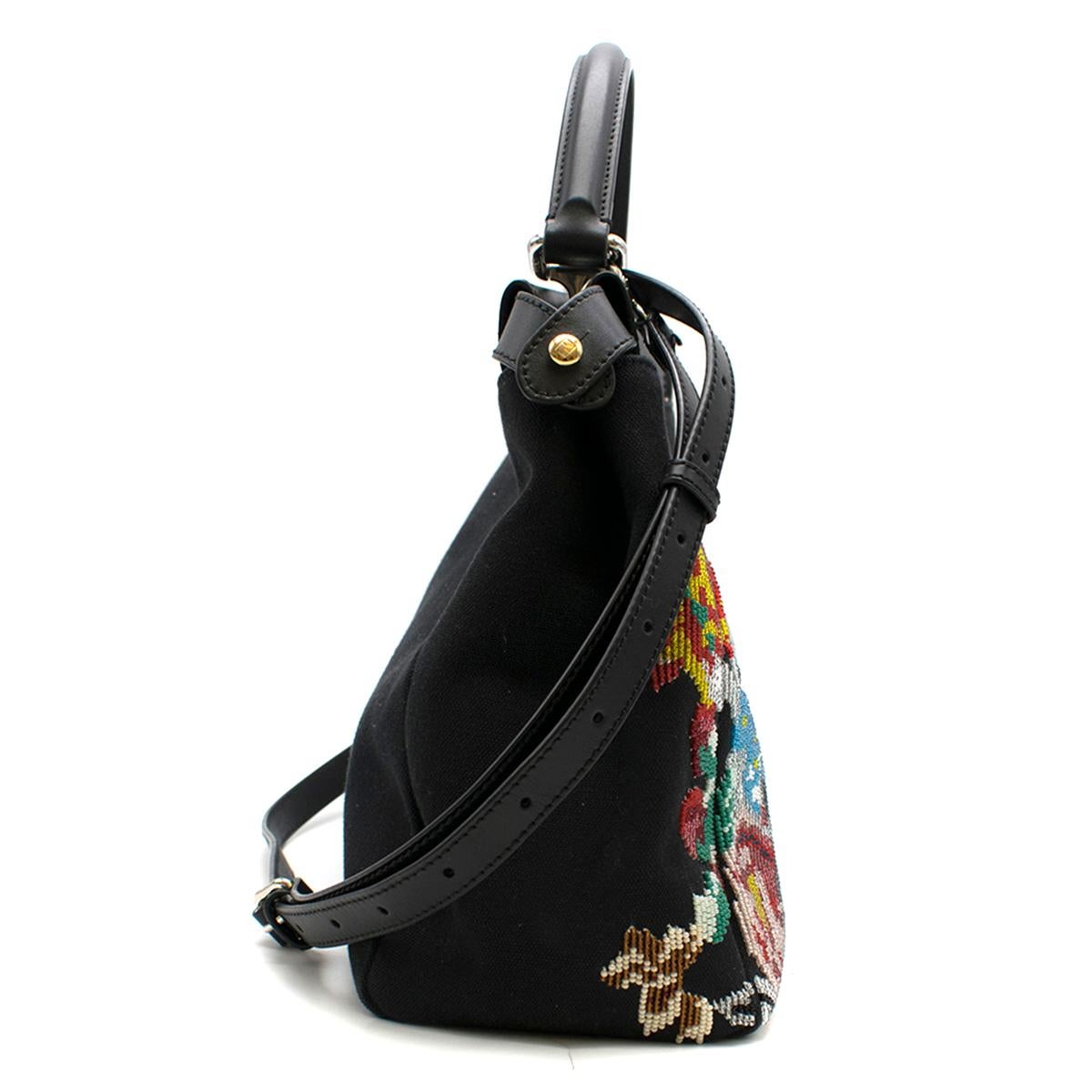 Fendi Black Floral Beaded Canvas Peekaboo Bag 

- Black Top Handle Bag
- Woven canvas outer with multi colored floral bead pattern at front bottom
- Leather top edge and base 
- Single leather handle with silver and gold toned hardware 
- Dual twist