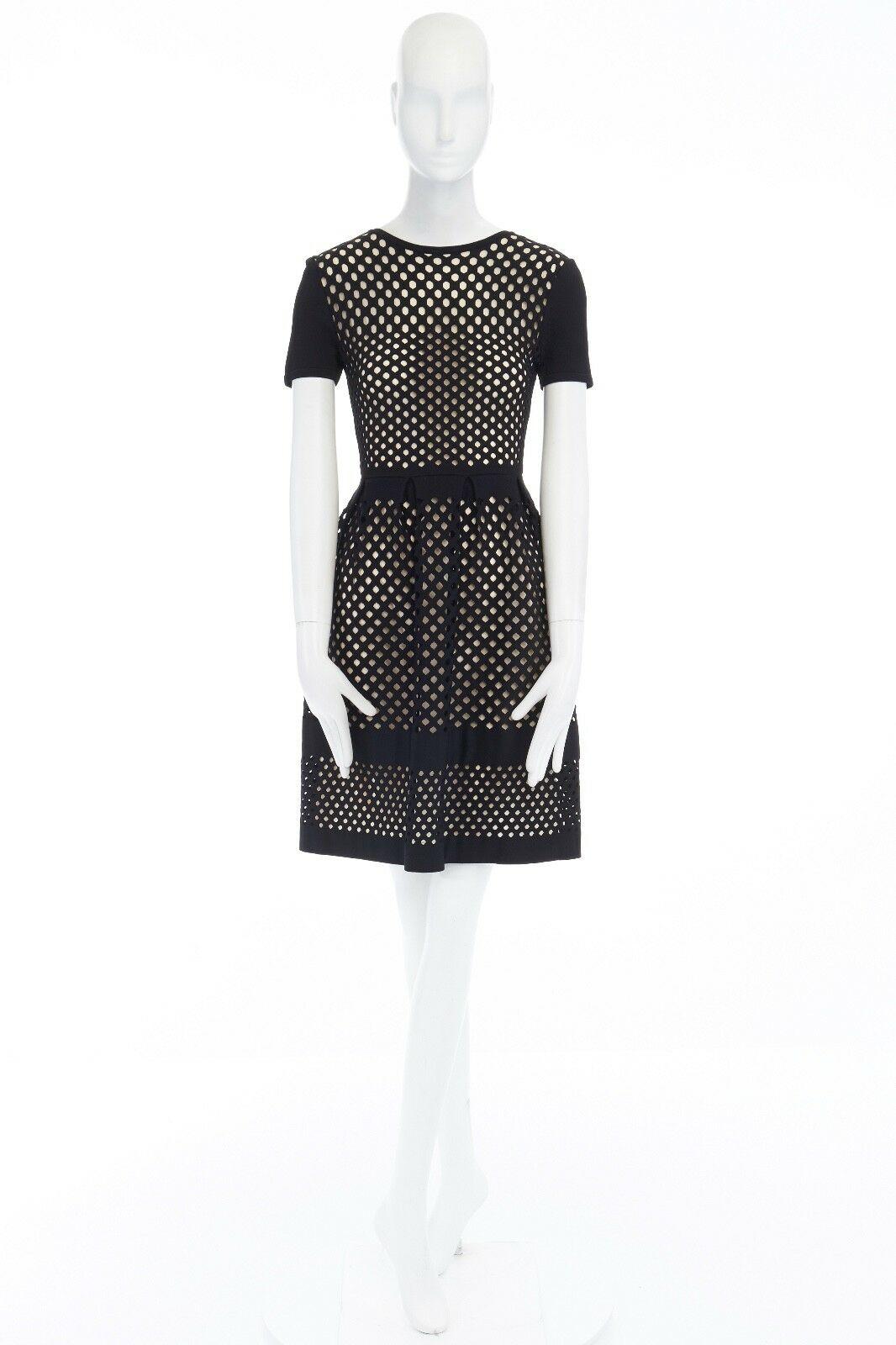 FENDI black geometric cut out beige lined fit flared cocktail dress IT36 US0 XS 
Reference: LNKO/A00503 
Brand: Fendi 
Material: Viscose 
Color: Black 
Pattern: Geometric 
Closure: Zip 
Extra Detail: Viscose, polyester, polyamide, silk, elastane.