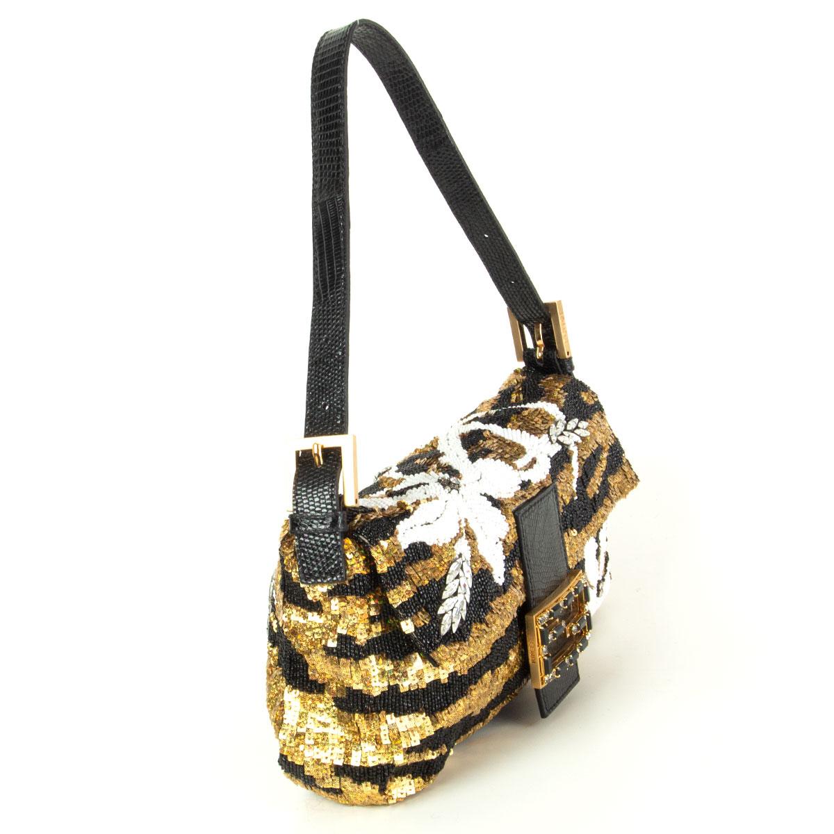 Fendi 'Mini Baguette' in black gold sequins with white beading featuring black lizard buckle and shoulder strap. The FF buckle and leaves are embellished with black and clear crystals. Lined in black satin silk with one zipper pocket against the