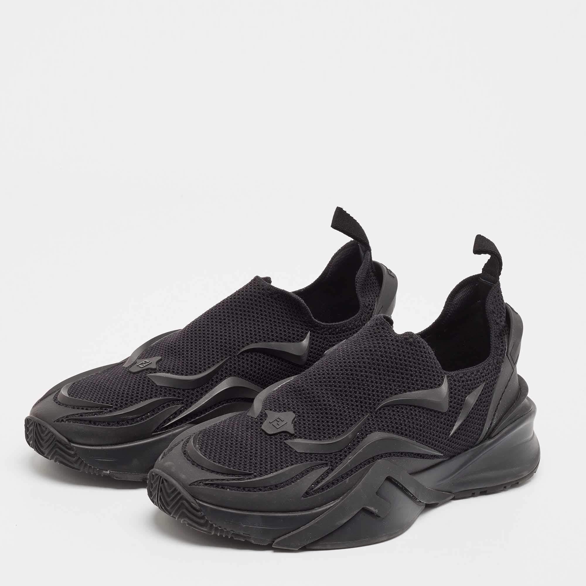These chic Fendi sneakers are designed for every occasion. Coming in a classic black color  these lace up and zipper sneakers feature engraved Fendi Flow lettering embossed on the counters. Made of leather  they combine casual sports with luxury.