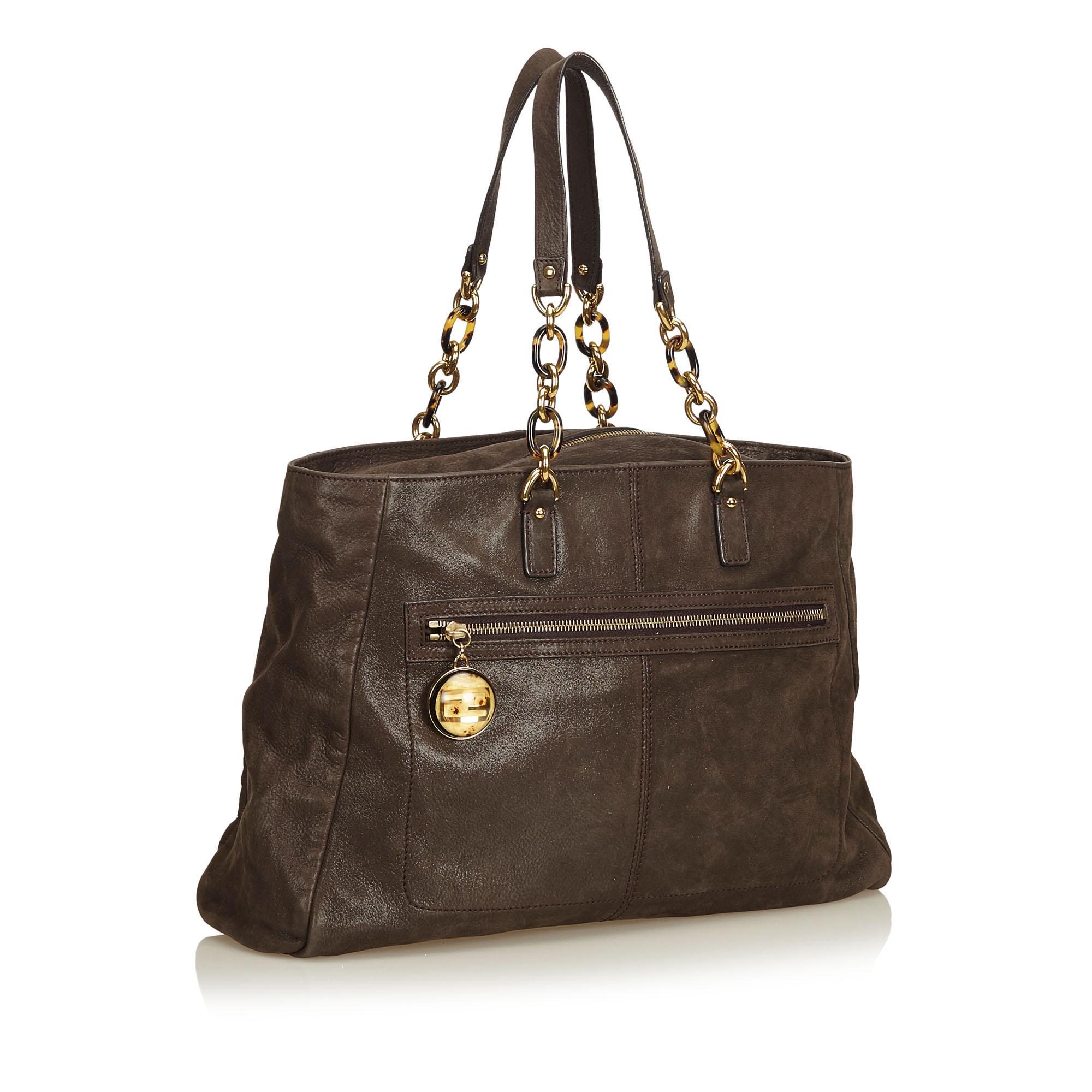 This shoulder bag features a lamé leather body, flat leather straps with chain details, top zip closure, exterior zip pocket, and an interior slip pocket. It carries as AB condition rating.

Inclusions: 
Dust Bag

Dimensions:
Length: 28.00 cm
Width:
