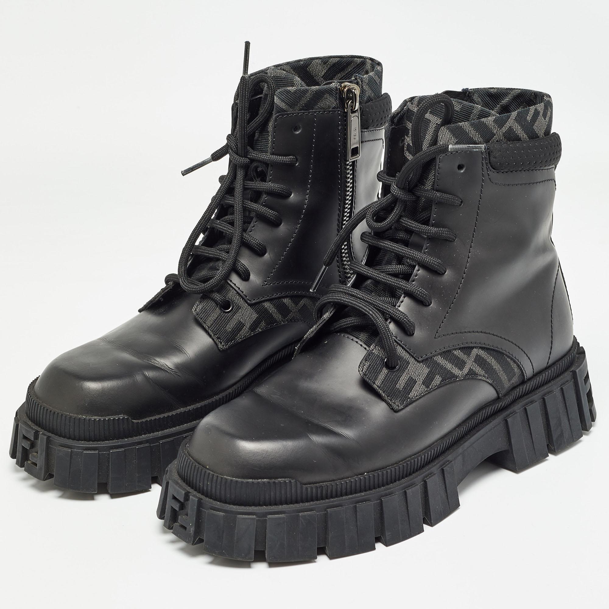 A sleek design amplified by skillful craftsmanship, these Fendi black boots for men assure comfortable fashion. They are sewn using leather and canvas.