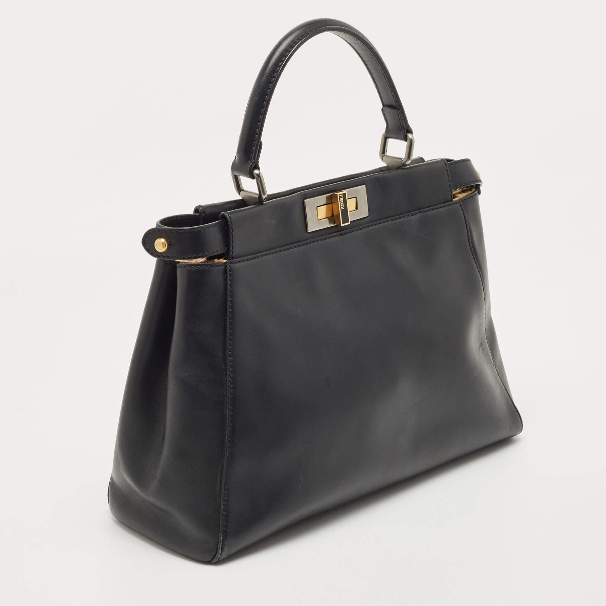 Perfect for conveniently housing your essentials in one place, this Fendi bag is a worthy investment. It has notable details and offers a look of luxury.

