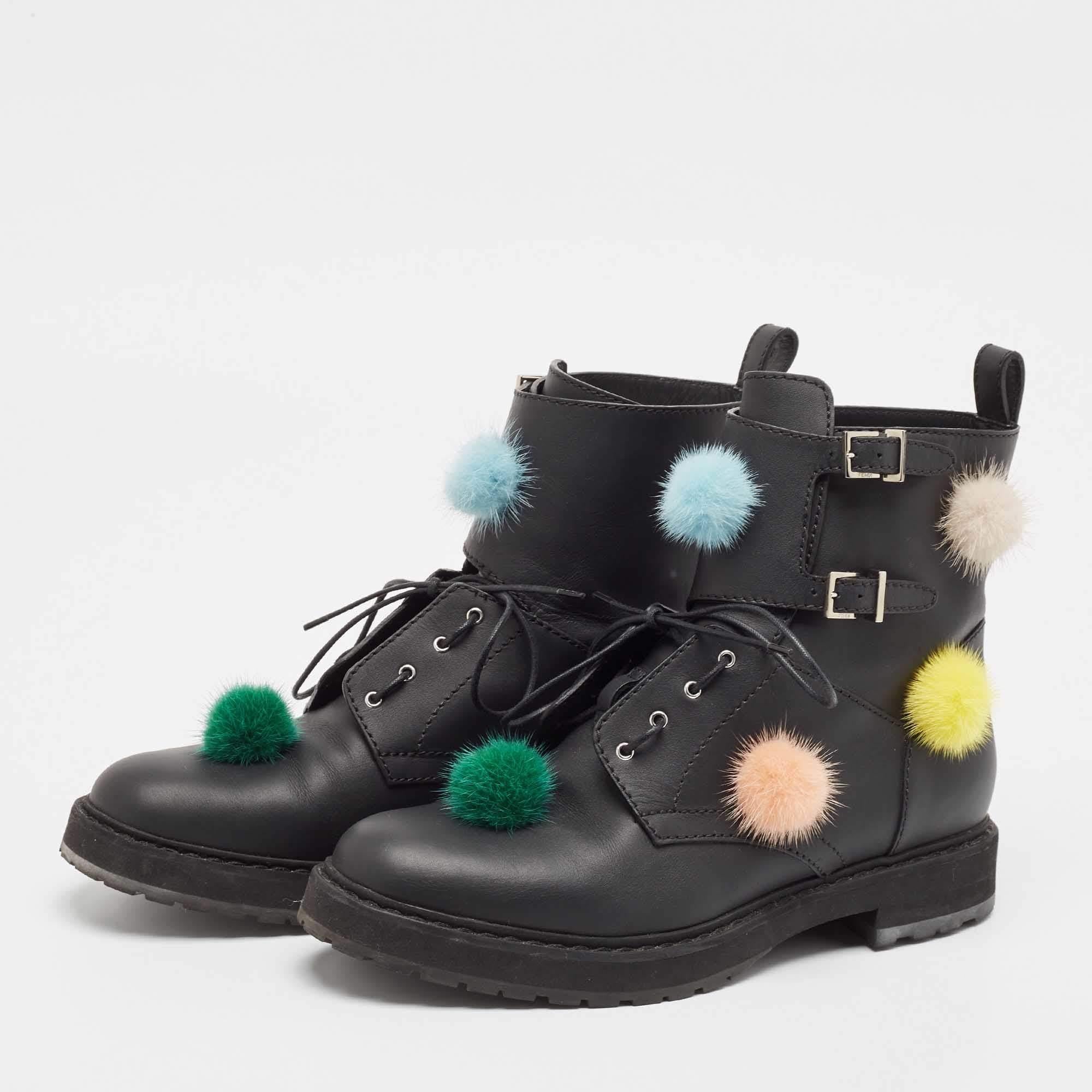 Treat your feet to this gorgeous pair of biker boots from Fendi. Crafted from black leather this pair features covered toes rubber soles and lace up closure. The insoles are lined with leather and the pair is complete with pompom detailing on the