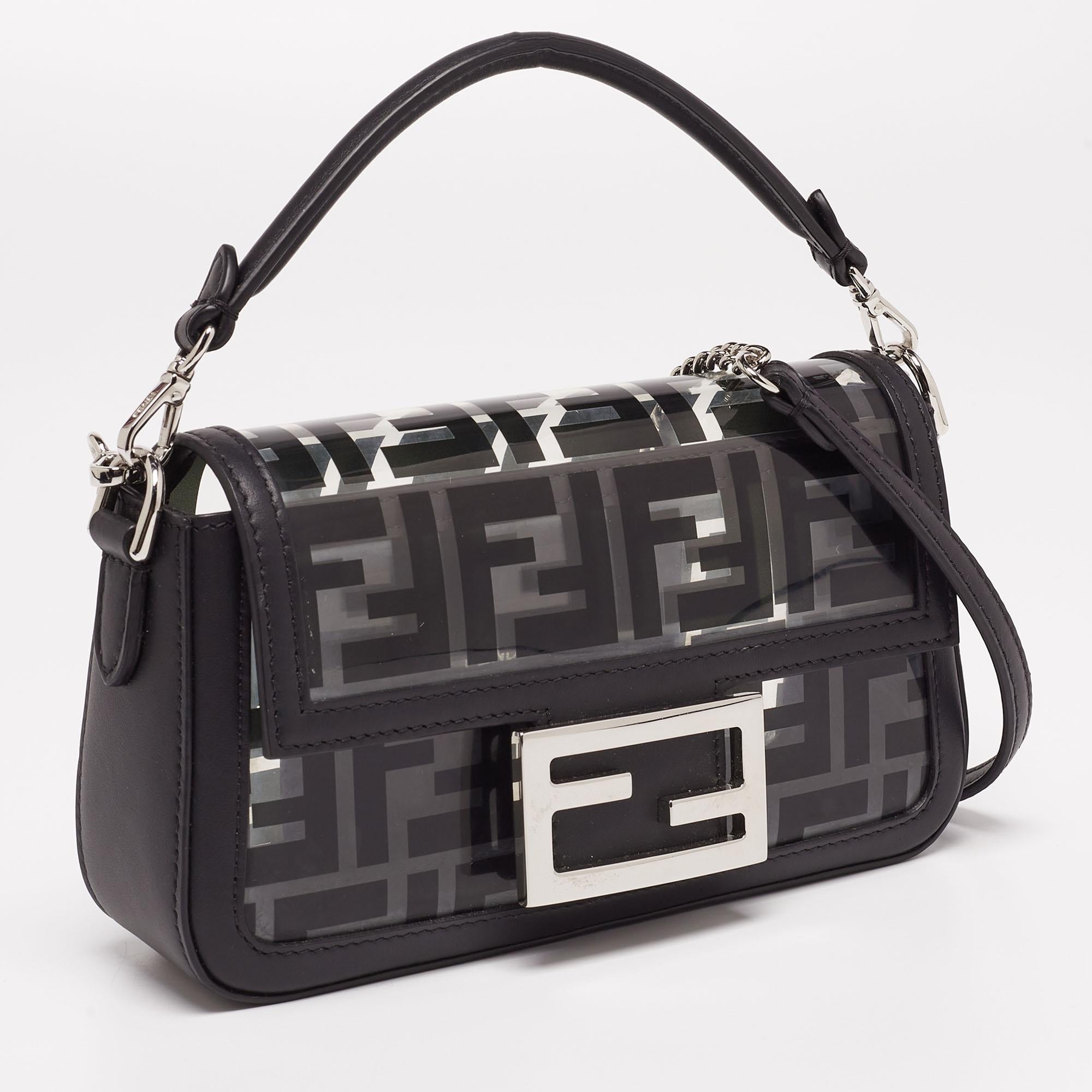 Make a chic style statement with this baguette bag from the House of Fendi. It has been designed using black leather and Zucca PVC on the exterior. It is supported by a single handle and is adorned with silver-tone hardware. Carry this Fendi