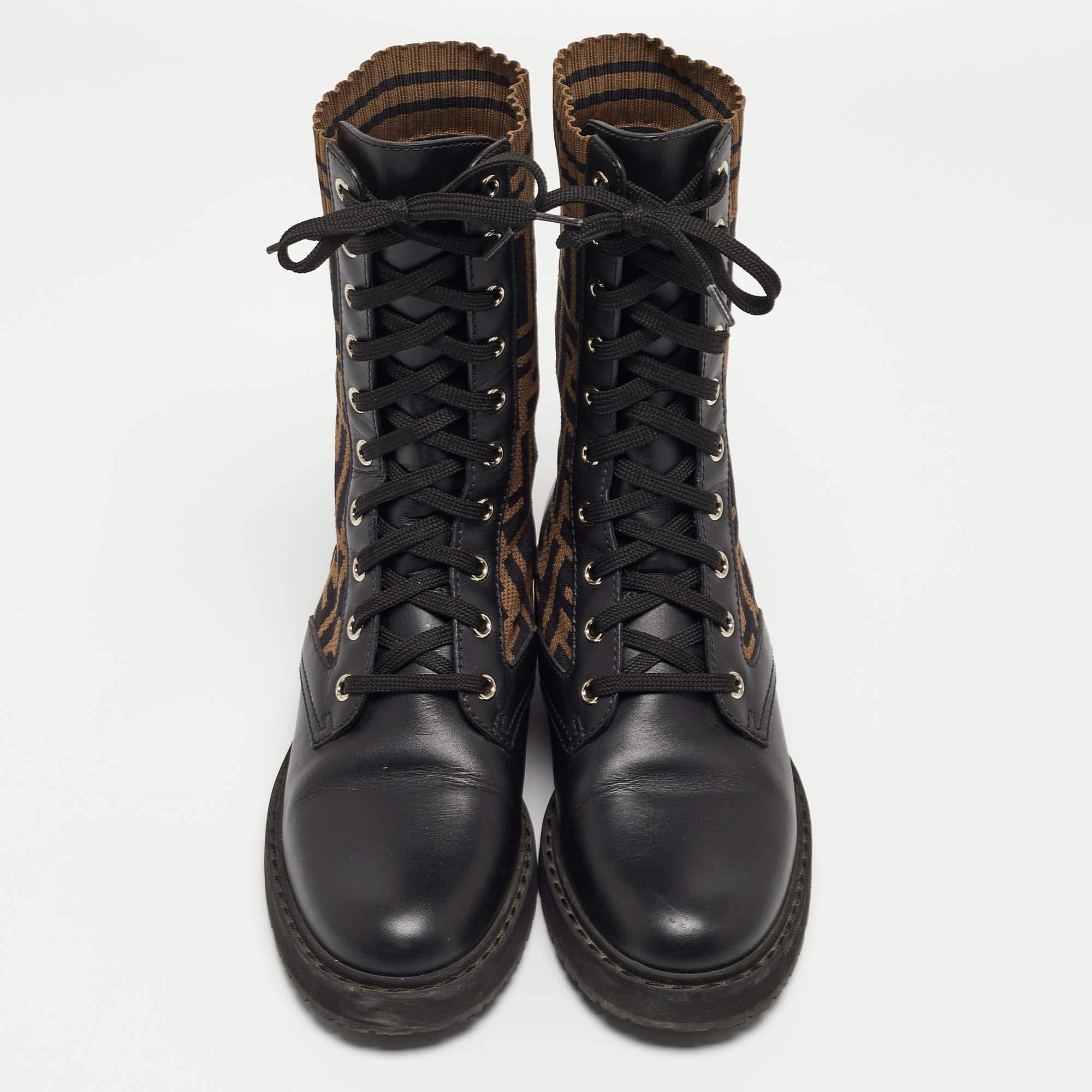 These stylish Rockoko combat boots come from the house of Fendi. Crafted in Italy, they are made from leather in a lovely shade of black. They are styled with lace-up fronts, sock-style FF motif detailing in stretch fabric, and silver-tone hardware.