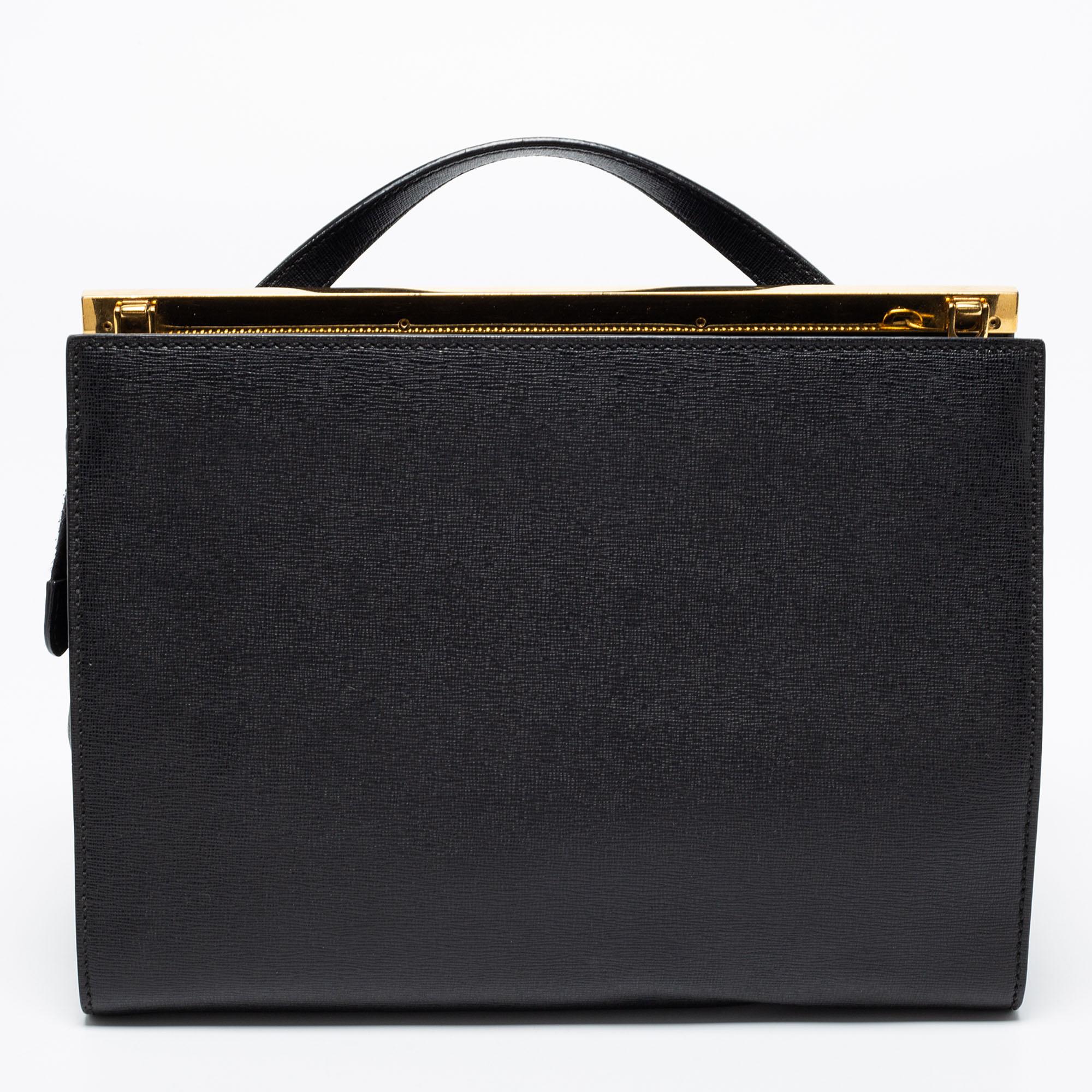 This Demi Jour bag by Fendi is not only lovely to look at but is also handy and durable. It has been crafted from black leather and styled very artistically with a flap compartment in the front and a zipper one at the back. The insides are
