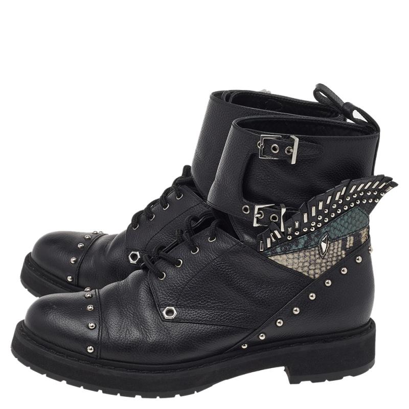 Striking and truly edgy, these ankle boots by Fendi are stunning. They have been crafted from quality leather, carry a black shade, and are embellished with silver-tone hardware. The buckled detailing and the python-embossed leather adds to the