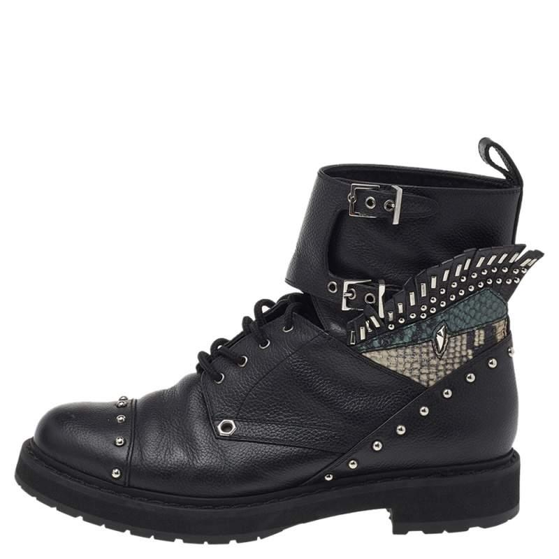 Striking and truly edgy, these ankle boots by Fendi are stunning. They have been crafted from quality leather, carry a black shade, and are embellished with silver-tone hardware. The buckled detailing and the python-embossed leather adds to the