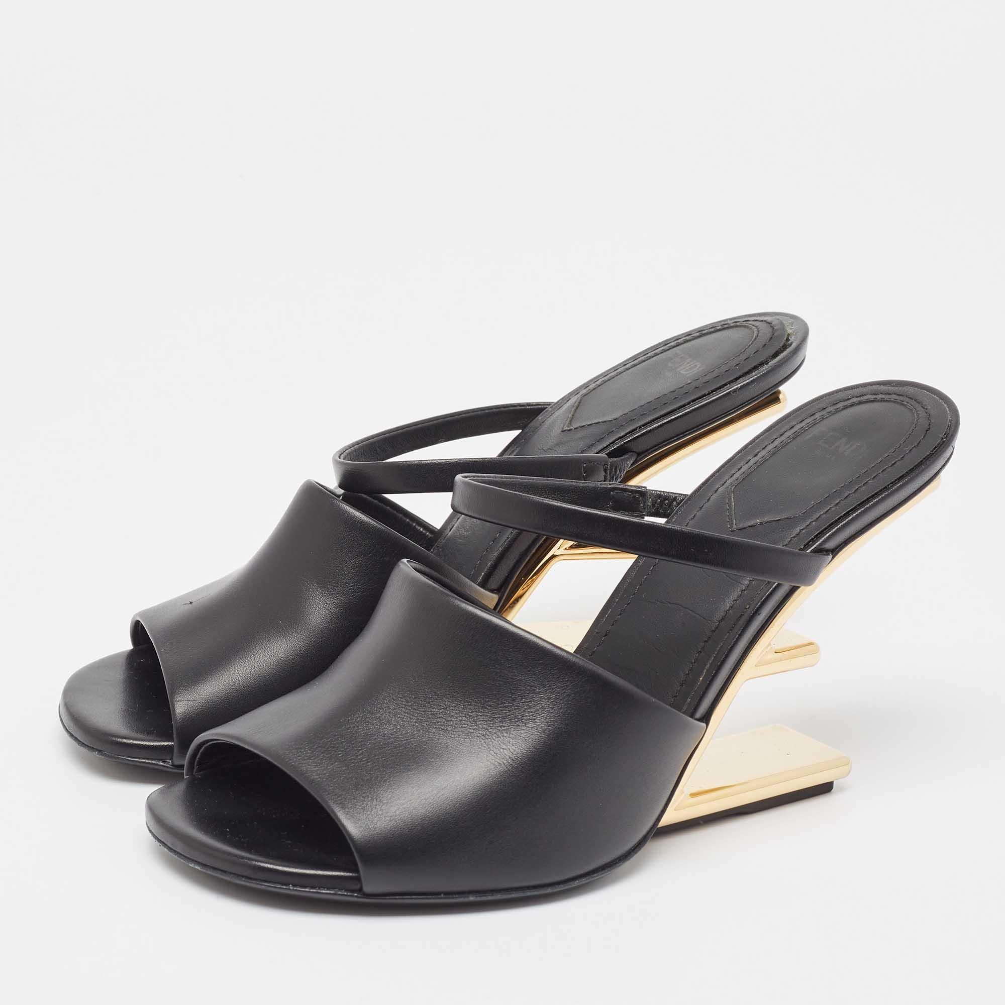 Crafted from exquisite black leather, these sandals exude sophistication and elegance. The iconic Fendi logo is carved into heels, showcasing the brand's renowned style. With a comfortable slip-on design and a sleek silhouette, these sandals are the
