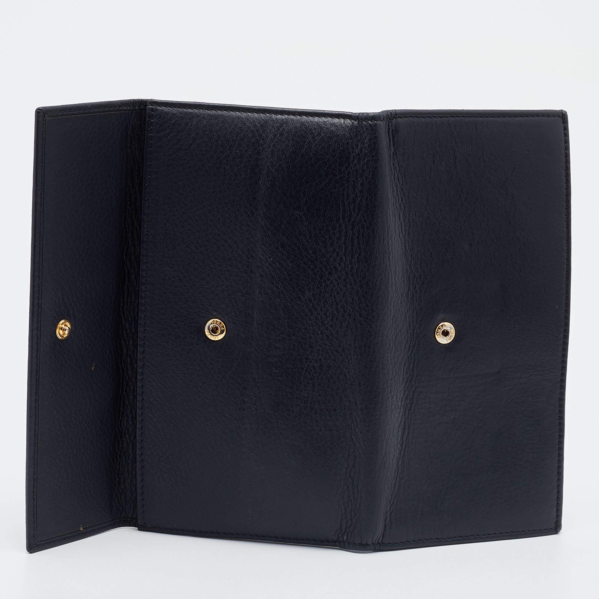 Made using black leather  this continental wallet from Fendi has a simple look and functional quality. The flap opens to a well sized interior featuring open compartments.