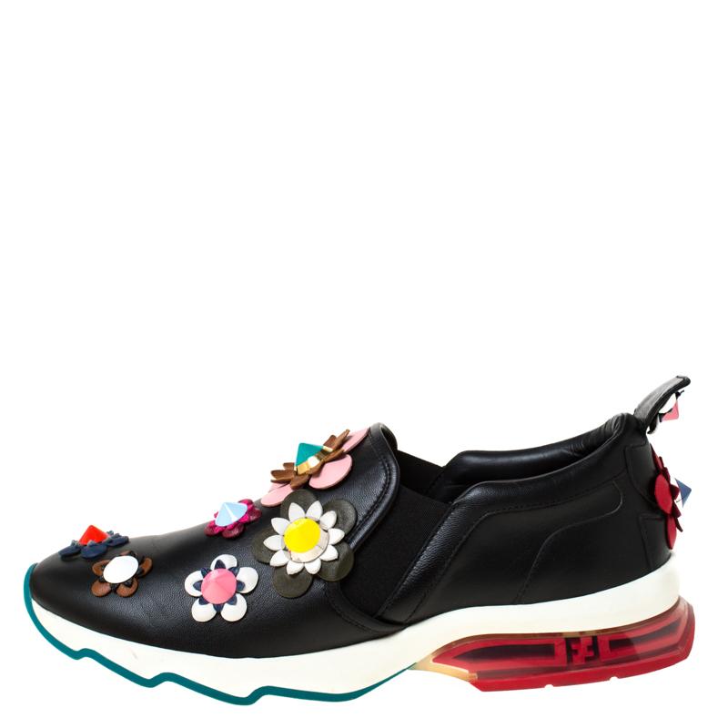 To accompany your attires with ease, Fendi brings you this pair of sneakers that speak nothing but high style. They've been crafted from leather and designed with floral appliques. The sneakers are easy to slip on and they are elevated on