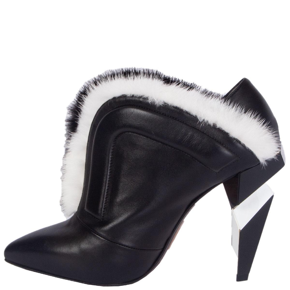 100% authentic Fendi ankle-boots in black smooth nappa leather with black and white fur trim. Features a black and white geometrical pvc heel. Has a very faint dent in the left heel. Brand new. Come with dust bag. 

Measurements
Imprinted