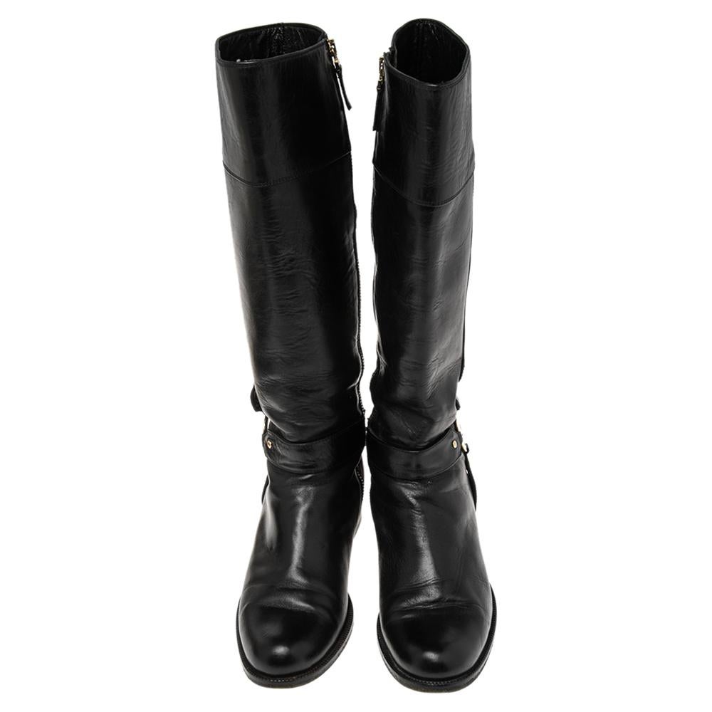If the quest is for a pair of black boots, we'll gladly choose this one by Fendi. The women's boots are crafted from leather as knee-high and designed with gold-tone logo details and low heels. The boots are fashionable and comfortable.

