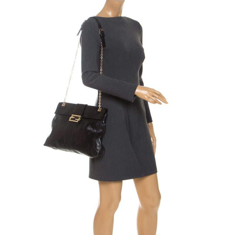 The Baguette was created by Fendi in 1997 and it was an instant rage Cease the wait and grab this beauty to experience the return of one of the earliest It bags in fashion. Crafted from black leather  it is accentuated with gold tone hardware. It