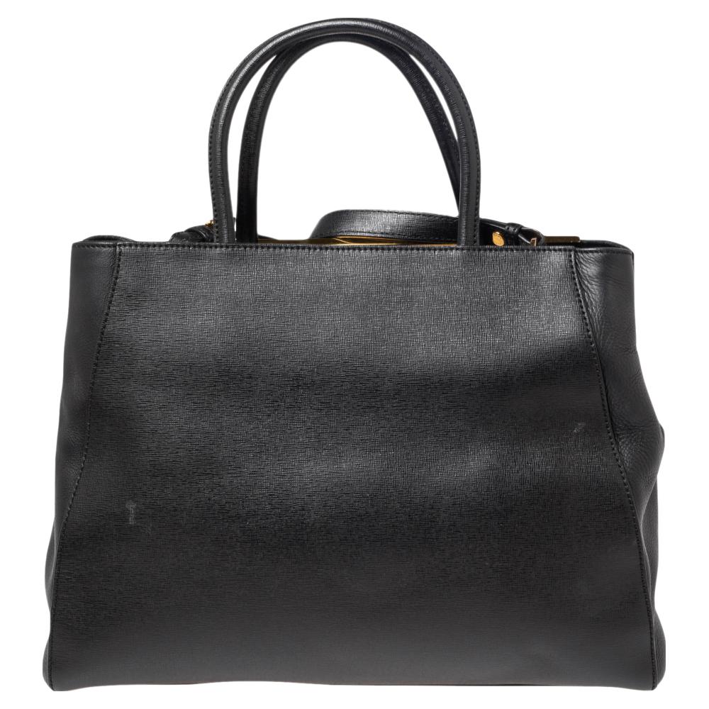 Fendi's 2Jours tote is one of the most iconic designs from the label and it still continues to receive the love of women around the world. Crafted from black leather, the bag features double handles. It is also equipped with a fabric interior and