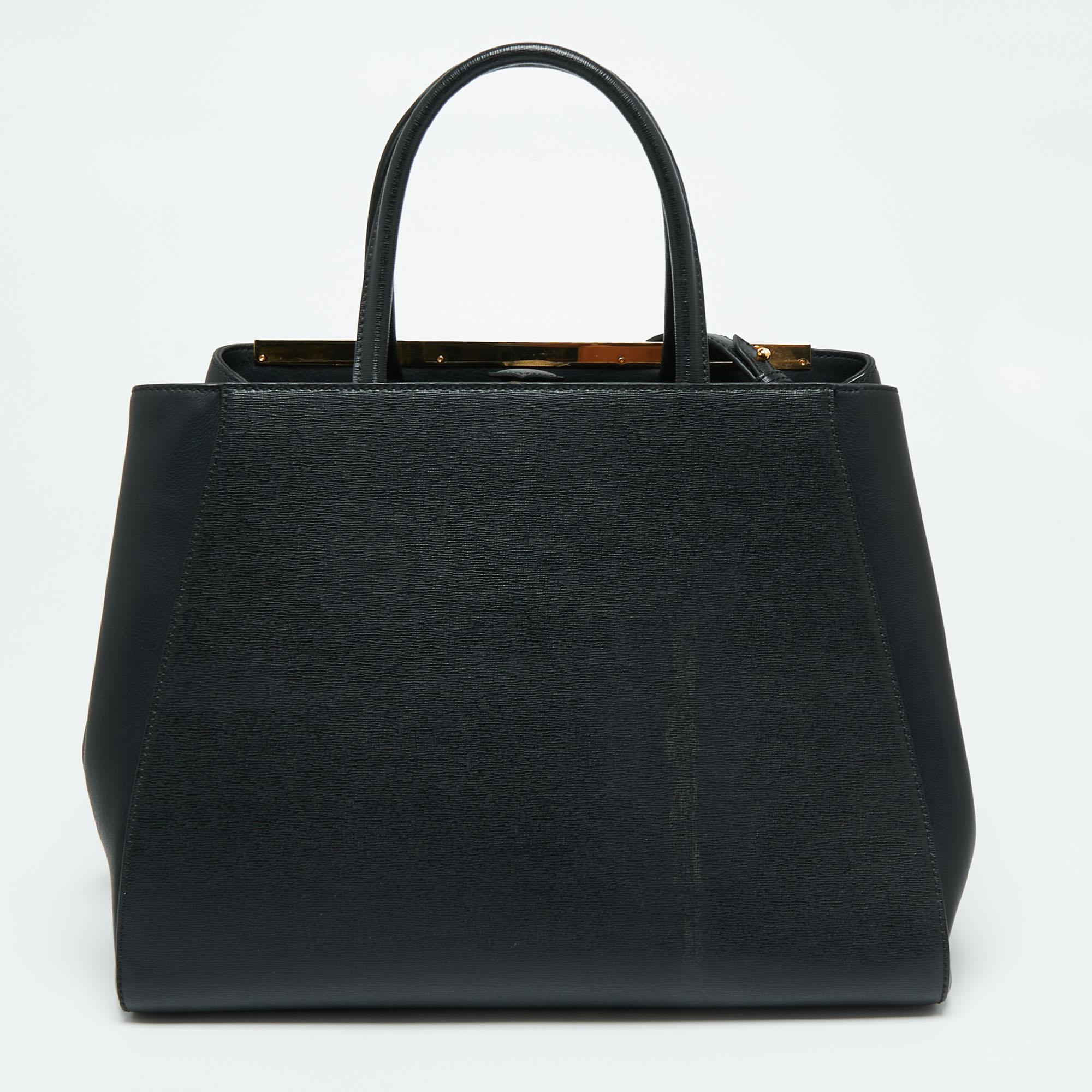 Fendi's 2Jours tote is one of the most iconic designs from the label and it still continues to receive the love of women around the world. Crafted from black leather, the bag features double handles and a strap. It is equipped with a fabric interior