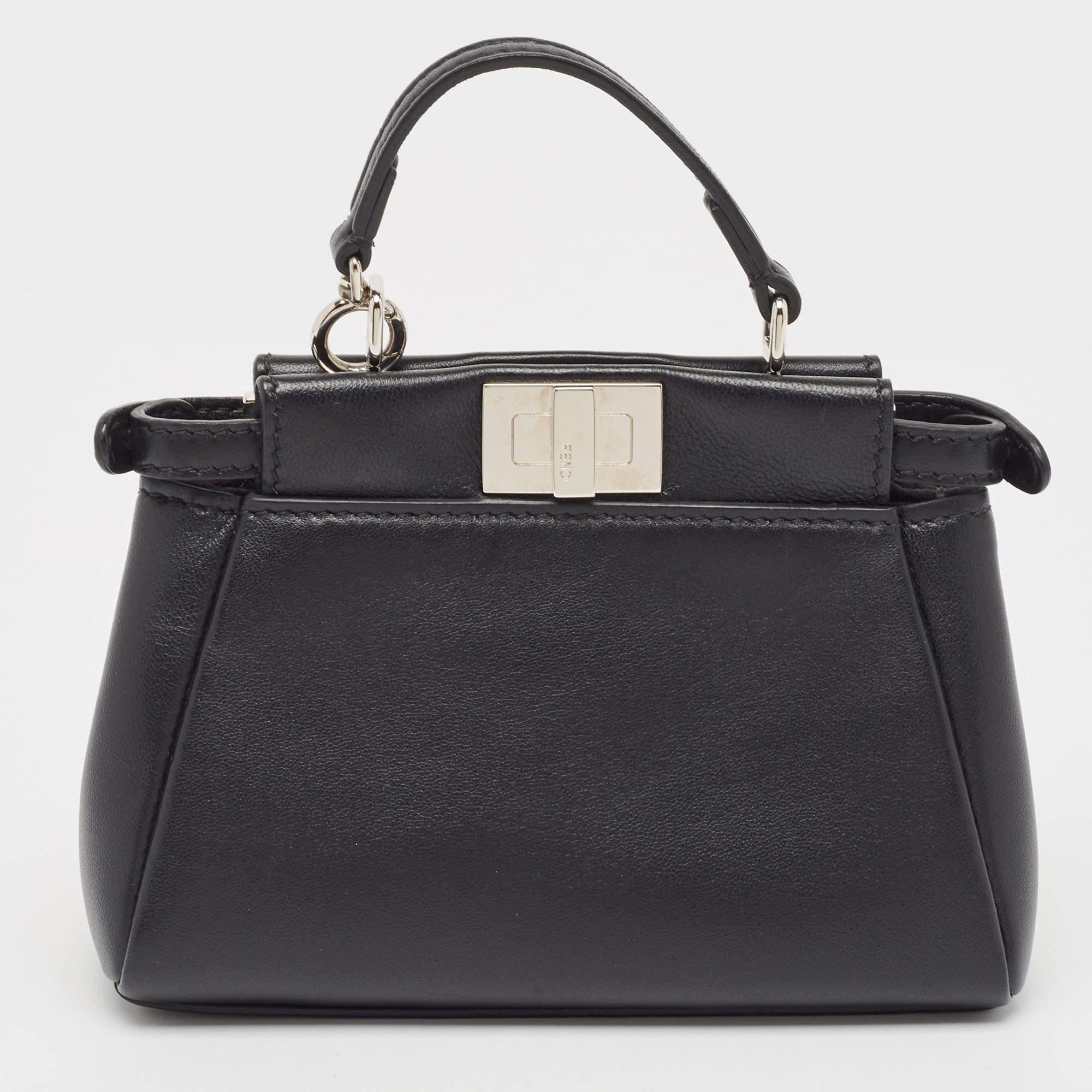 This exquisite Peekaboo from Fendi is highly coveted, and since its birth in 2009, it has swayed us with its shape, design, and beauty. This version comes meticulously crafted from leather and designed with flower motifs as well as a top handle for