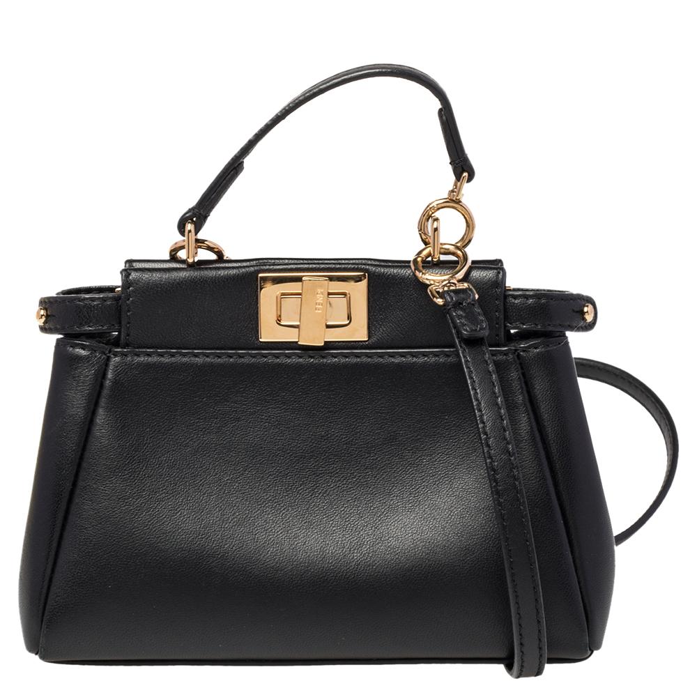 This exquisite Peekaboo from Fendi is highly coveted, and since its birth in 2009, it has swayed us with its shape, design, and beauty. This micro version comes meticulously crafted from leather and designed with a top handle for you to swing it.