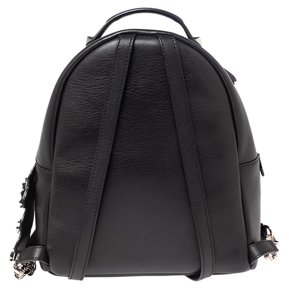 To accompany all your casual outings in the most fashionable way, Fendi brings you this backpack that boasts fabulous style. The leather bag has double zippers to secure the fabric interior and is held by a top handle and two shoulder straps. You'll