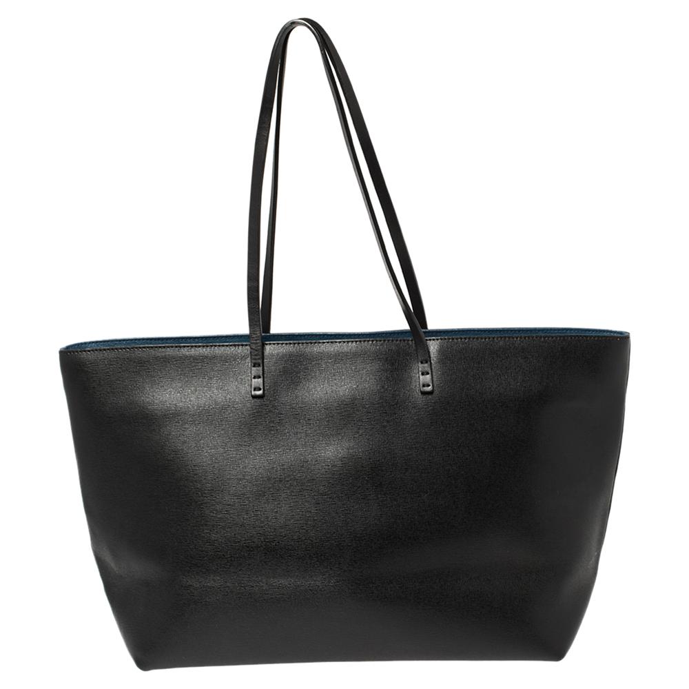This youthful shopper tote has ample space to house everything you need on your shopping binges. Rendered in durable leather and made in Italy, the black exterior is adorned with a playful version of the 'Monster' motif that the label is famous for.