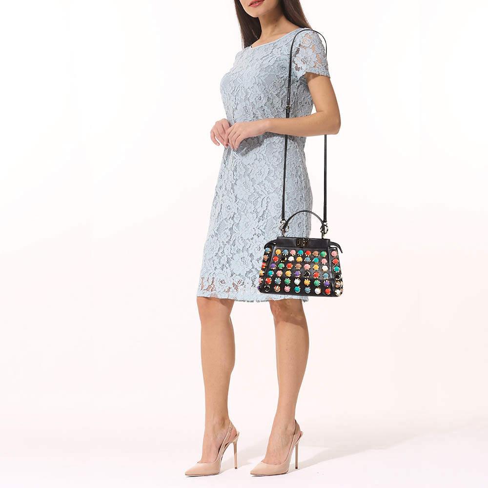 Designer bags are ideal companions for ample occasions Here we have a fashion meets functionality piece crafted with precision. It has been equipped with a well sized interior that can easily fit your small essentials.