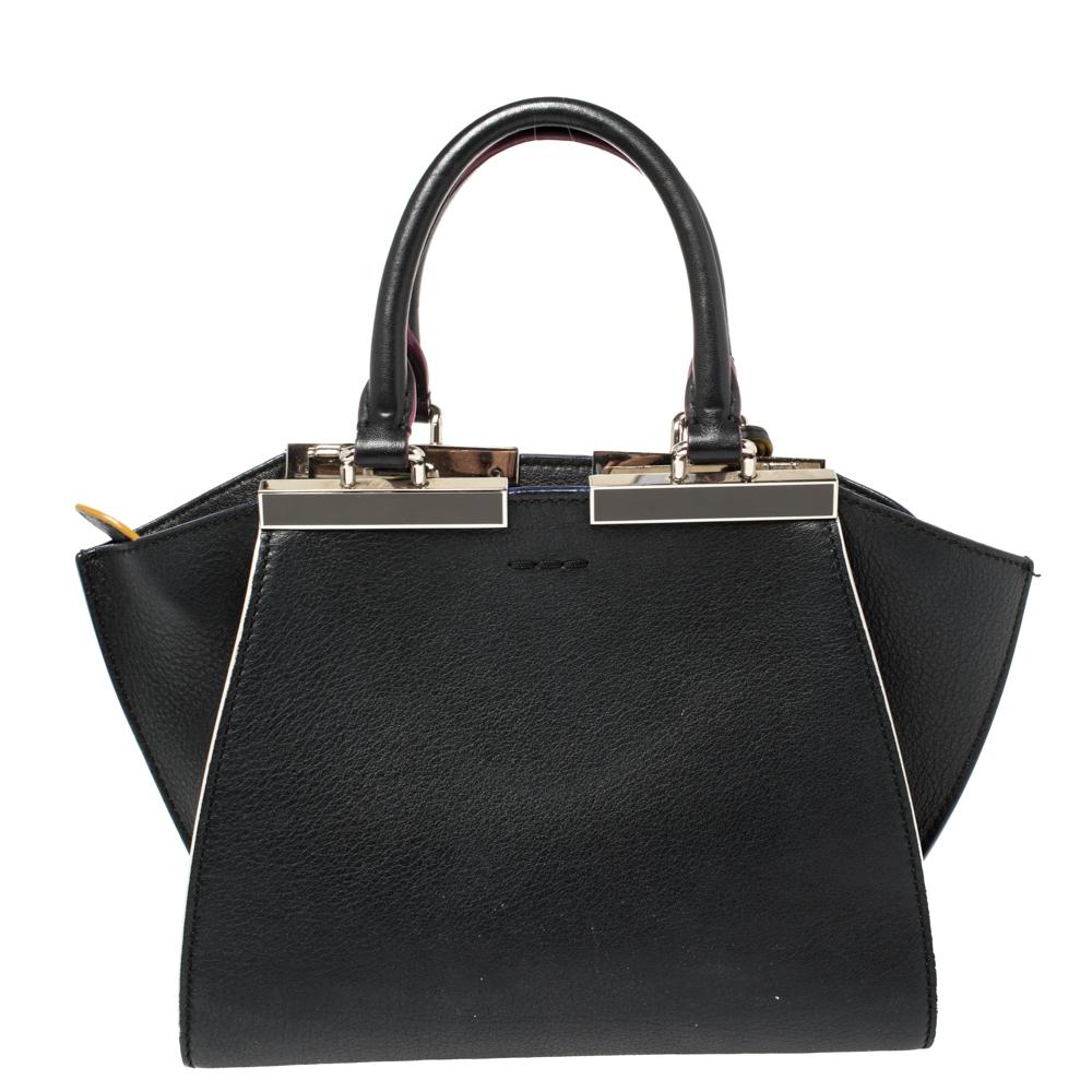 Fendi brings you this stunning update of their famous 2jours bag, the 3Jours! Crafted from leather, the black bag has two handles and a gorgeous silver-tone bar on top that is split down the middle. The insides are leather-lined and spacious enough