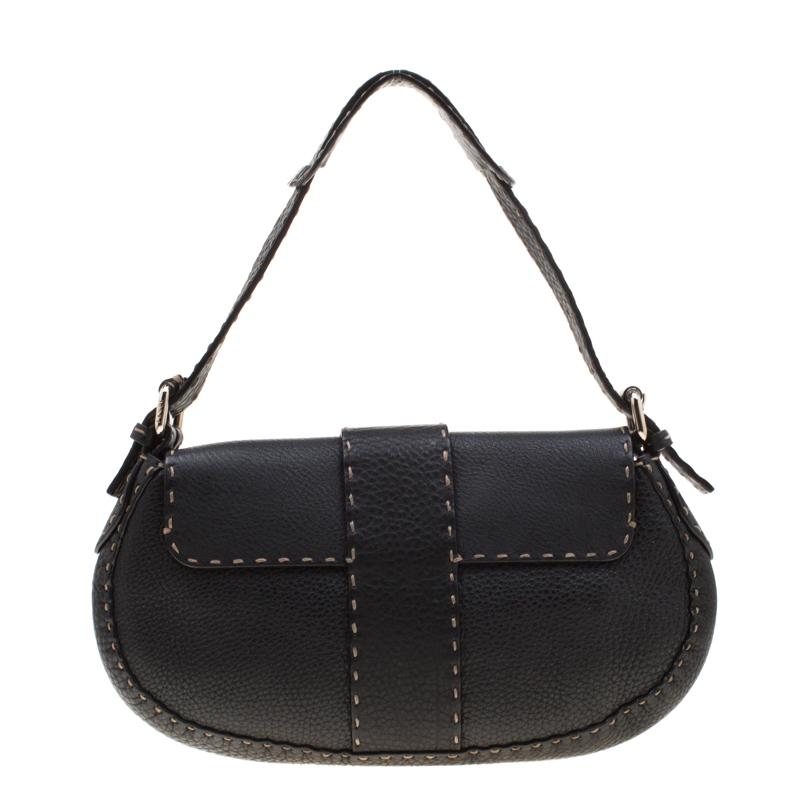 This Fendi creation is crafted from black leather featuring a silver-tone brand logo at the front. This Selleria shoulder bag is designed with a flap closure that opens to a well-sized suede interior. A classic piece of luxury to fill your closet