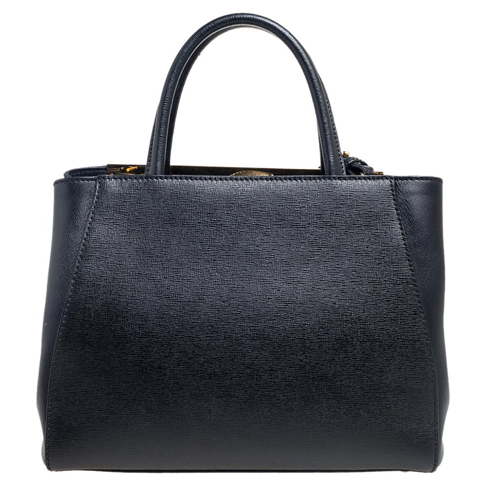 Fendi's 2Jours tote is one of the most iconic designs from the label and it still continues to receive the love of women around the world. Crafted from black leather, the bag features double-rolled handles and a shoulder strap. It is also equipped