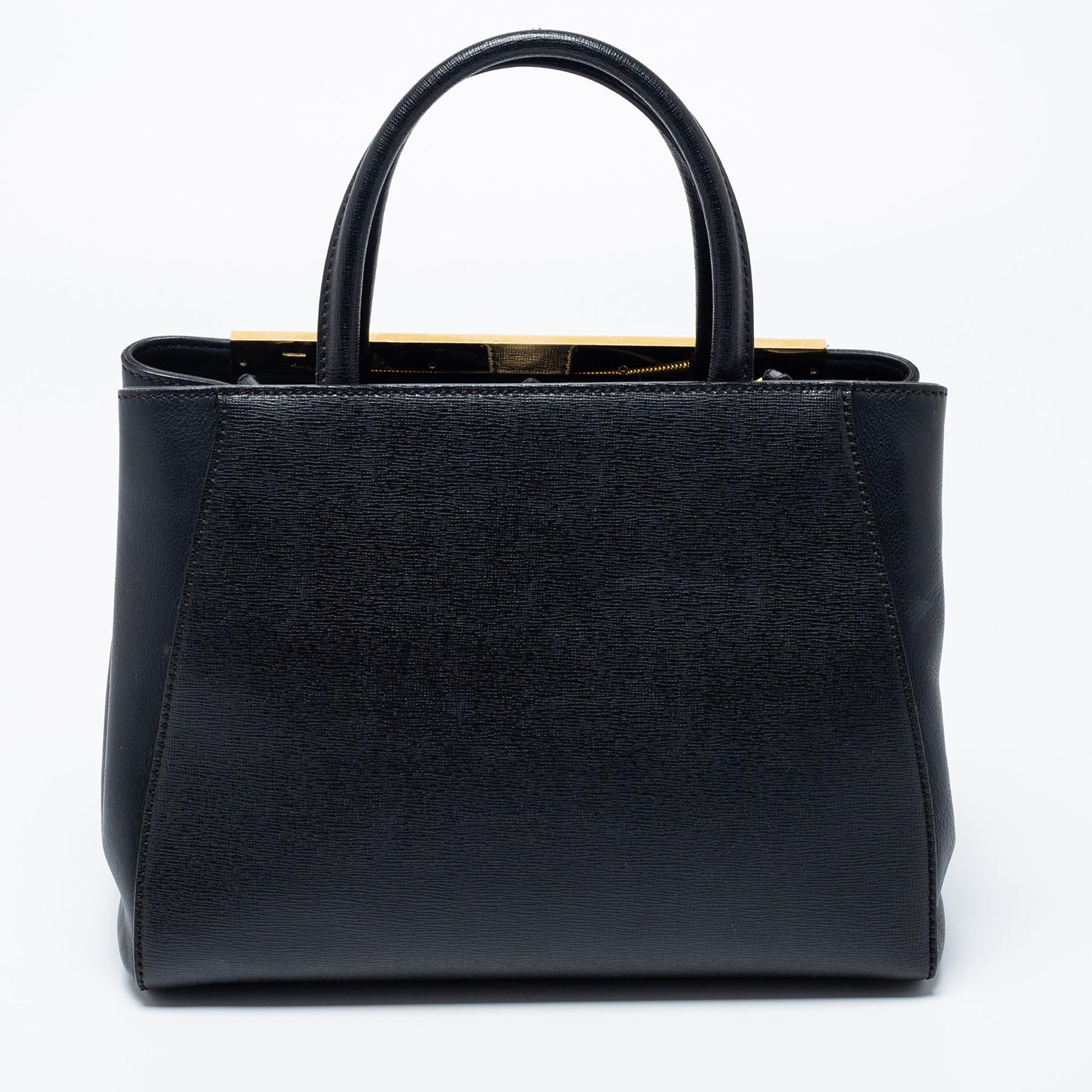 Fendi's 2Jours tote is one of the most iconic designs from the label and it continues to receive the love of women around the world. Crafted from black leather, the bag features double-rolled handles and a shoulder strap. It is equipped with a