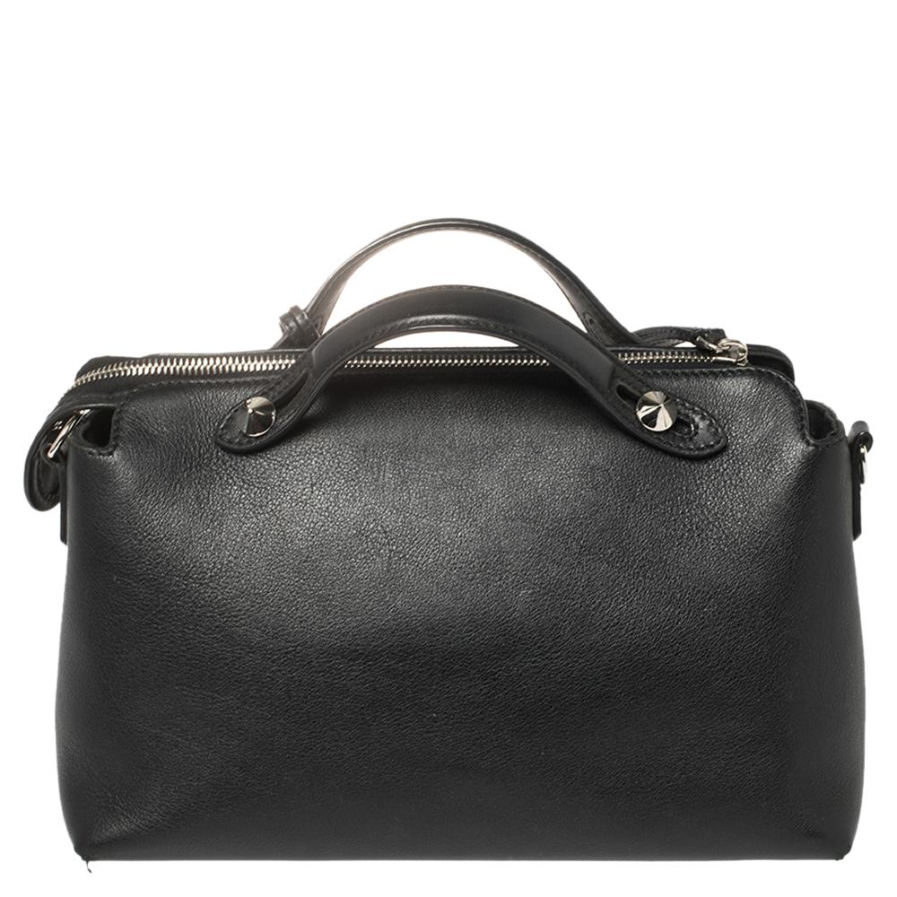 This By The Way Boston bag by Fendi sweetly embodies ladylike elegance! Crafted from leather in black, this pretty bag features a top zip closure that opens to a canvas interior housing the brand label and a zippered pocket. It is completed with two
