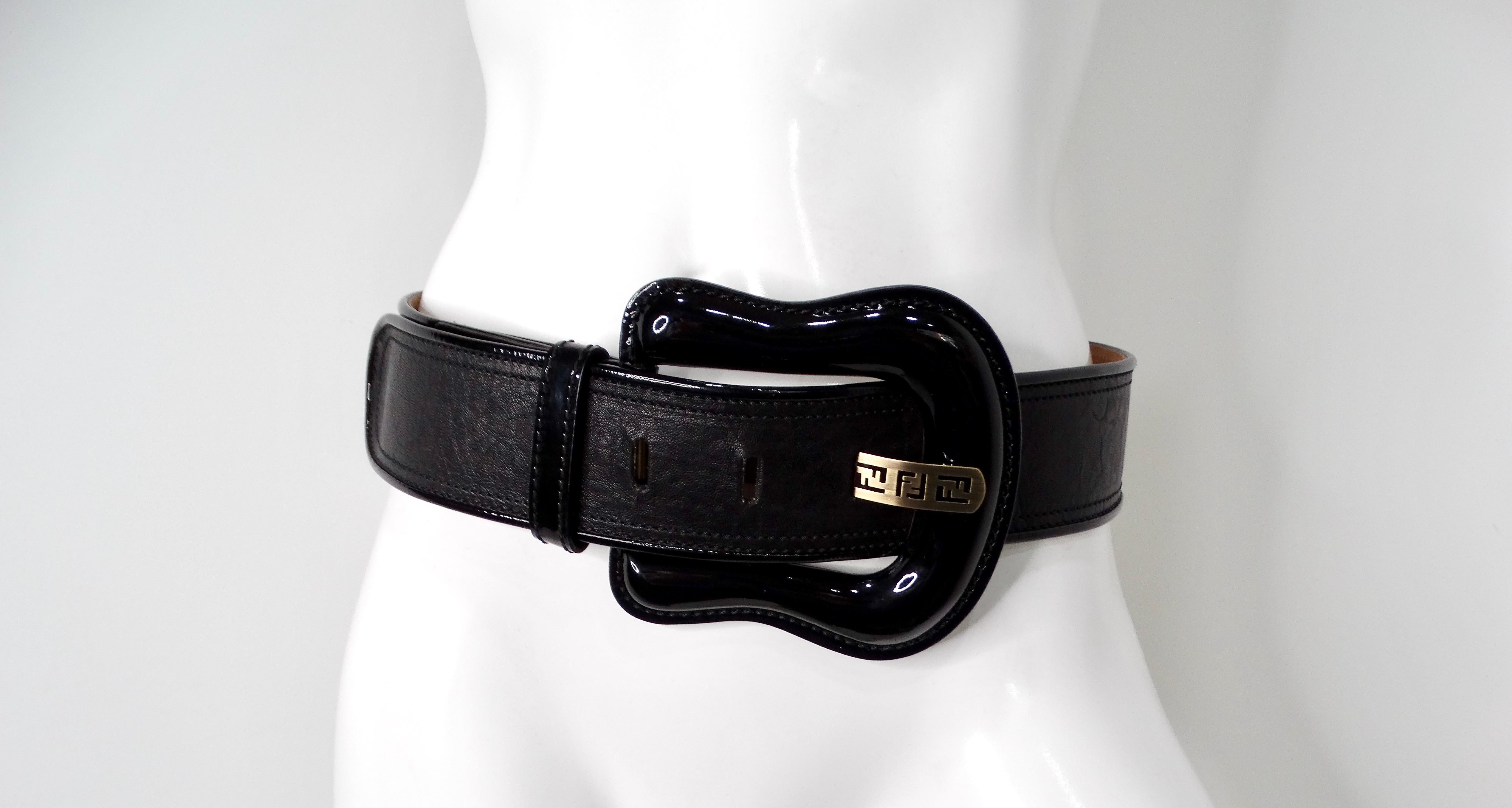 Elevate your accessory game with the Fendi Black Leather Waist Belt, an exquisite blend of luxury and contemporary style. This stunning belt features a bold chunky patent leather buckle that commands attention while showcasing a sleek silhouette.