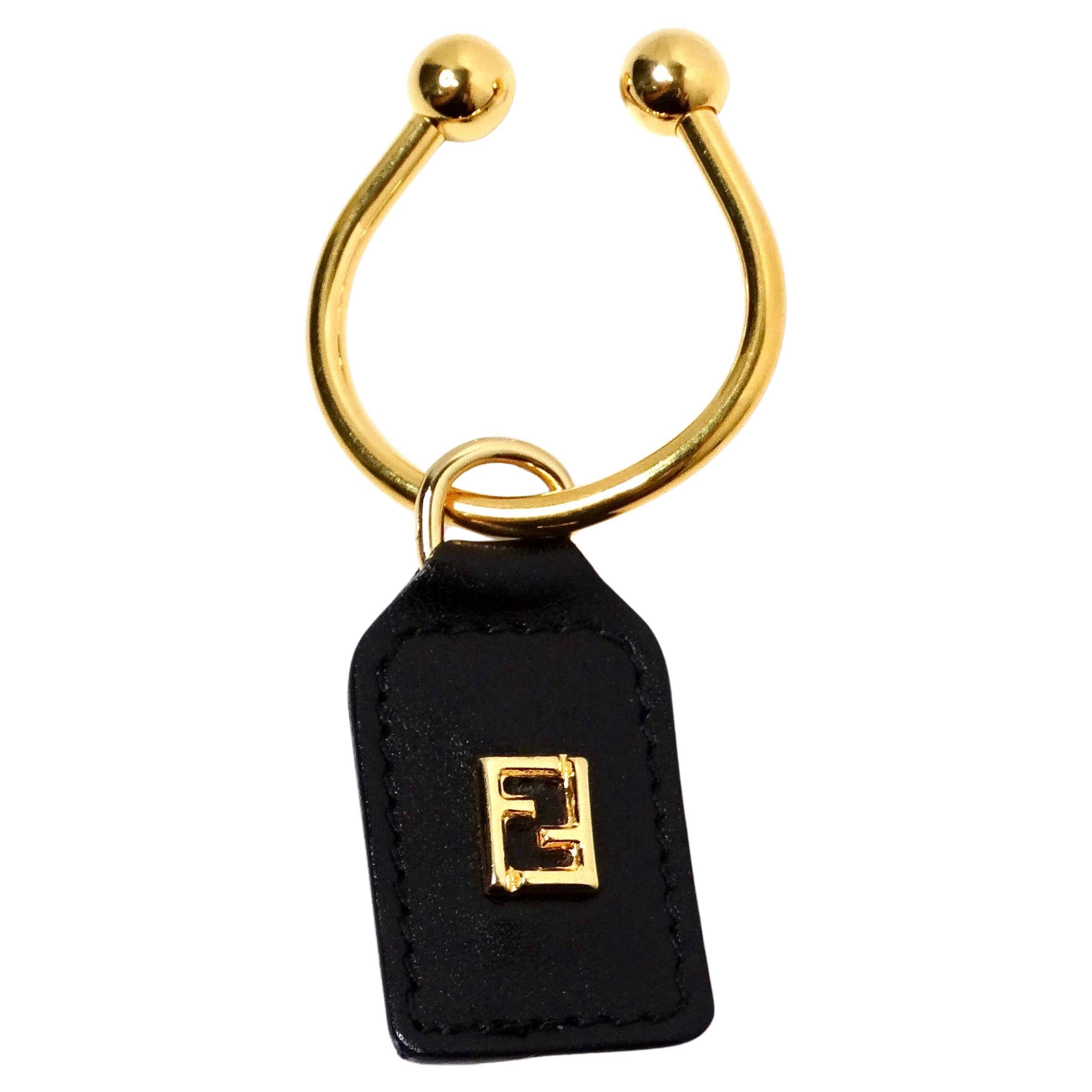 Portachiavi con logo Fendi in pelle nera e oro giallo in vendita