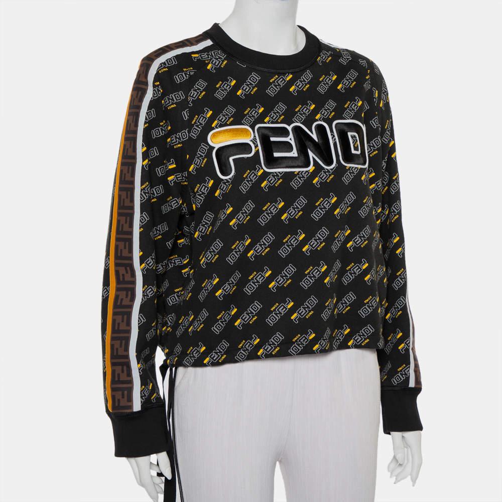Who doesn't love sweatshirts and when it comes to creations from Fendi, they are bound to impress! This black knit sweatshirt comes made from 100% cotton and styled with a waist tie detail and a logo print all over. It flaunts a crew neck and long