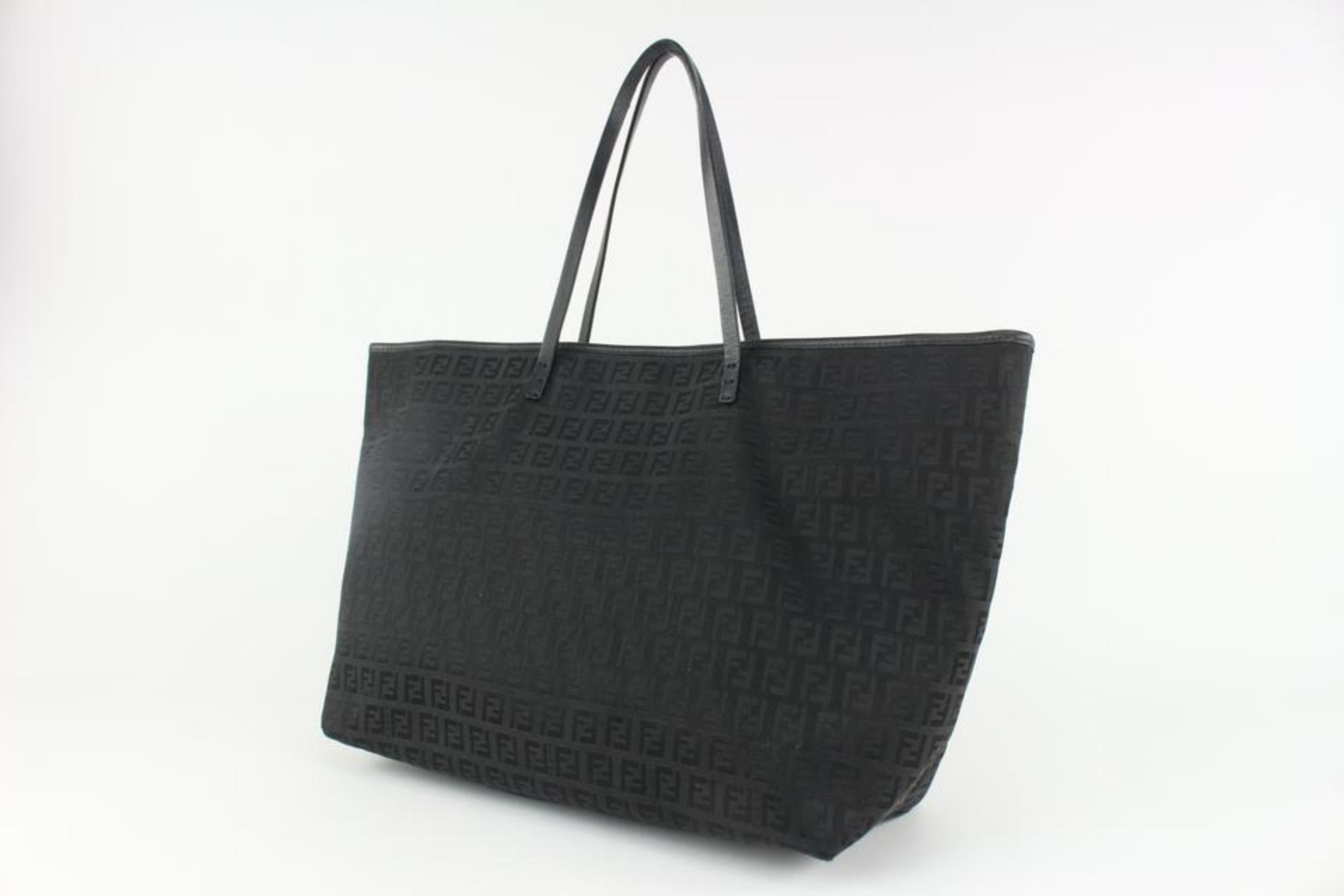 Fendi Black Monogram FF Zucca Roll Tote Bag 1123F35
Date Code/Serial Number: 2111-8BH076-083
Made In: Italy
Measurements: Length:  18.5