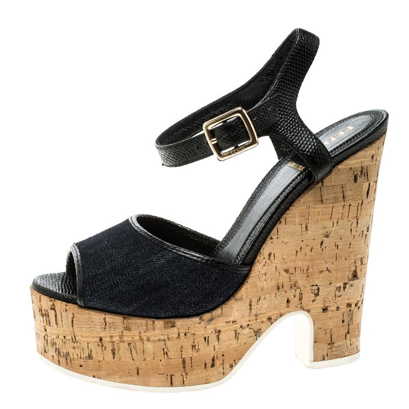 These sandals by Fendi are just the pair you need for a chic look every day. They are beautifully crafted from leather and denim and styled with ankle fastenings and 14 cm cork platforms. They'll look great with dresses and casual