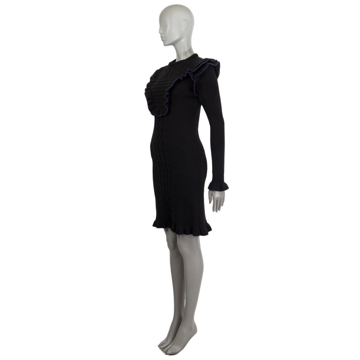 Fendi ribbed knit dress in black and navy blue missing tag (probably wool blend) with a detailed ruffle-trim all over, round neck, long sleeves, elastic fabric and mid weight knit. Unlined. Has been worn and in excellent condition.

Tag Size Missing