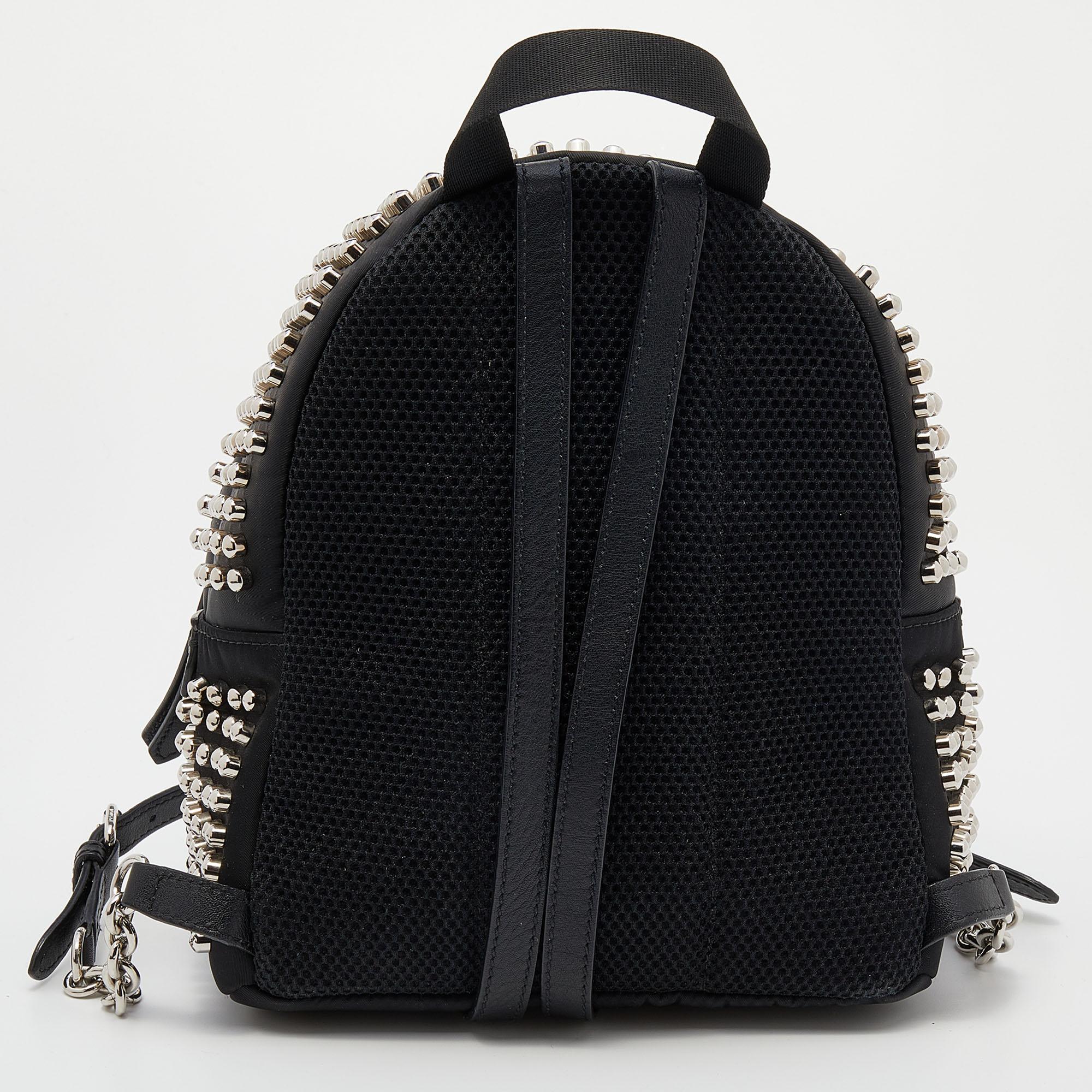 Fendi provides a fun alternative to your everyday bag. It is made of black nylon and leather. The backpack has zip compartments and stud details for a chic look.

