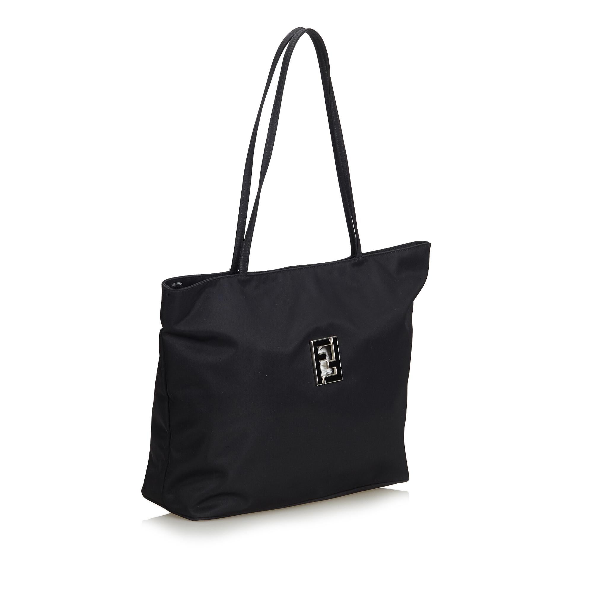 This tote bag features a nylon body, flat straps, top zip closure, exterior zip pocket and interior zip pocket. It carries as B+ condition rating.

Inclusions: 
Dust Bag

Dimensions:
Length: 30.00 cm
Width: 42.00 cm
Depth: 12.00 cm
Shoulder Drop: