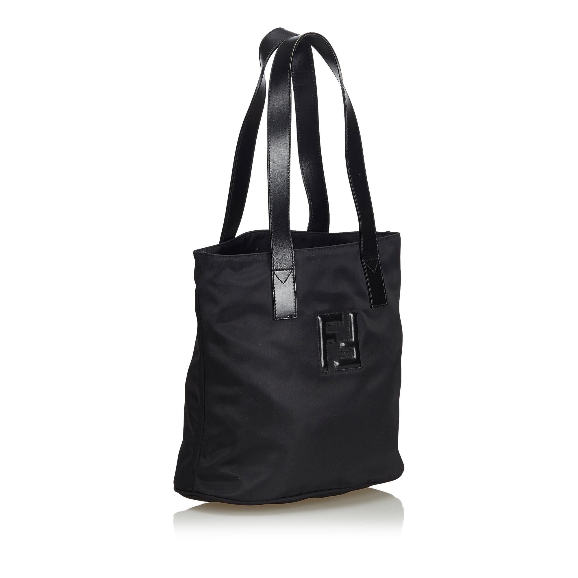 This tote bag features a nylon body, flat leather straps, open top, and interior zip and slip pockets. It carries as AB condition rating.

Inclusions: 
This item does not come with inclusions.

Dimensions:
Length: 26.00 cm
Width: 30.00 cm
Depth: